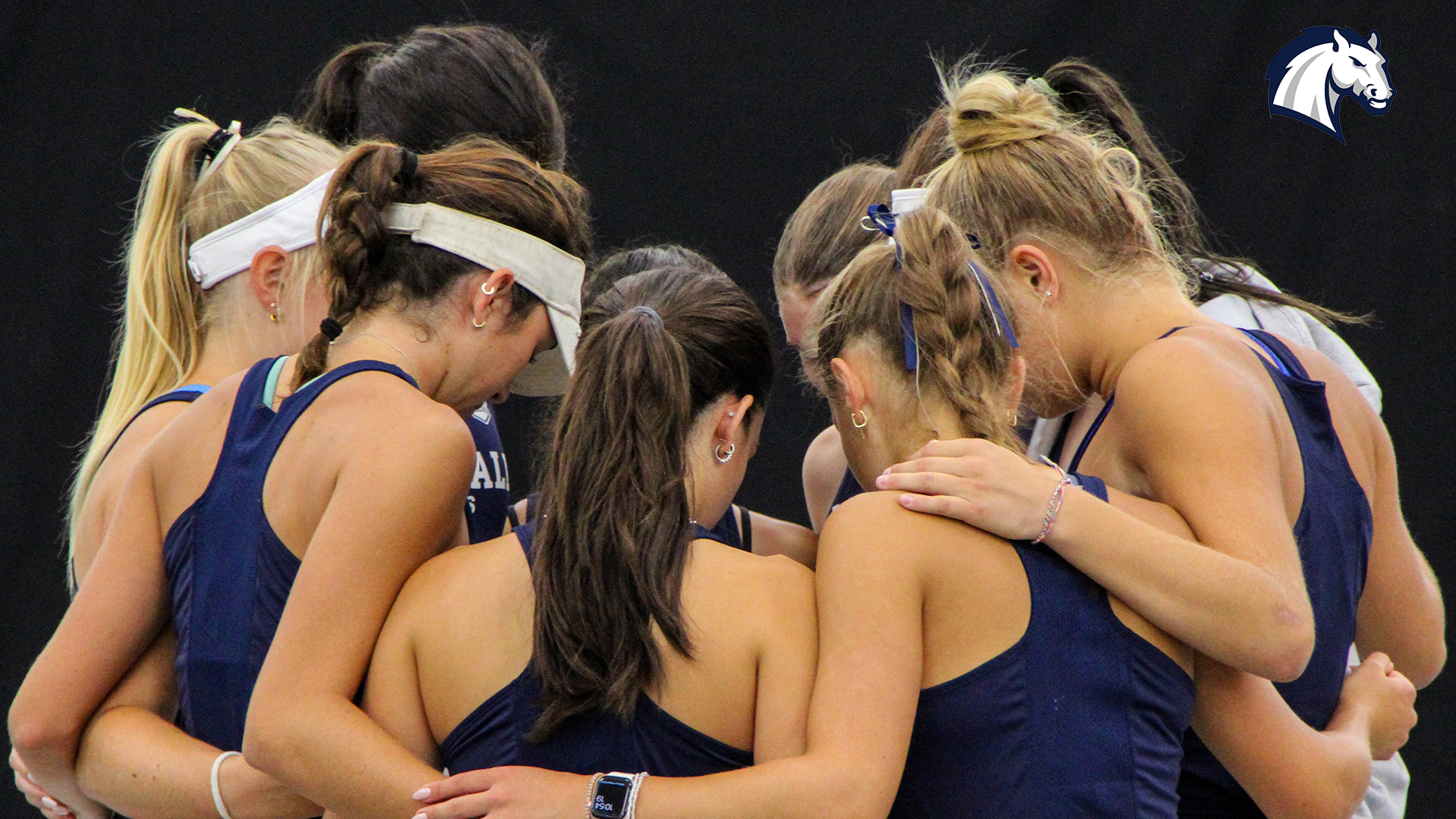 Hillsdale's women's tennis team huddles up before the start of the Chargers' 2026 home invitational.