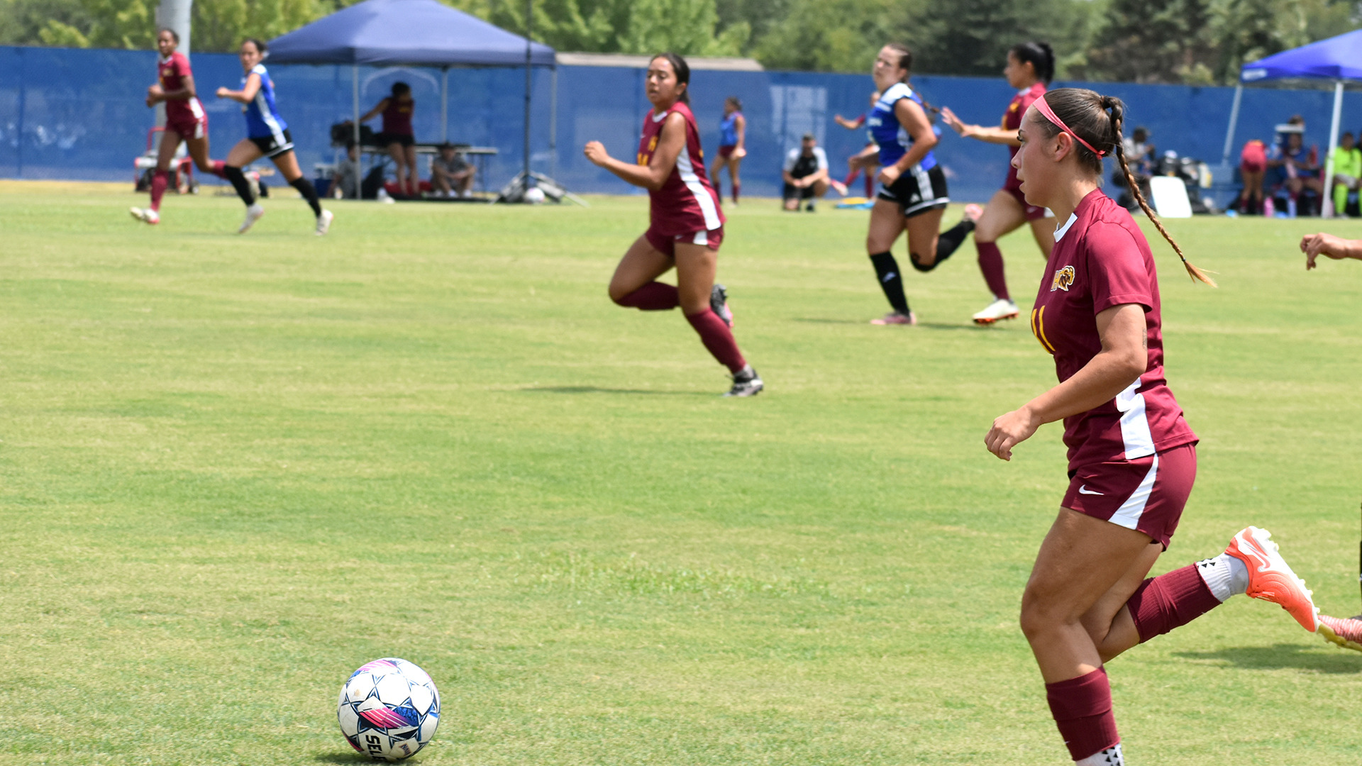 Women's soccer player Jerri Rodriguez-Gamez dribbles upfield during an HT attacking try