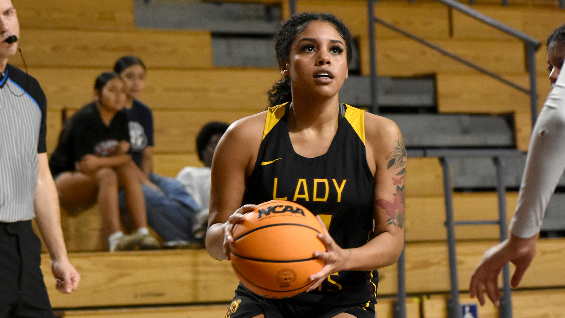 HT's women's basketball player Jade Hilliary drives toward the basket with the ball in a game earlier this season