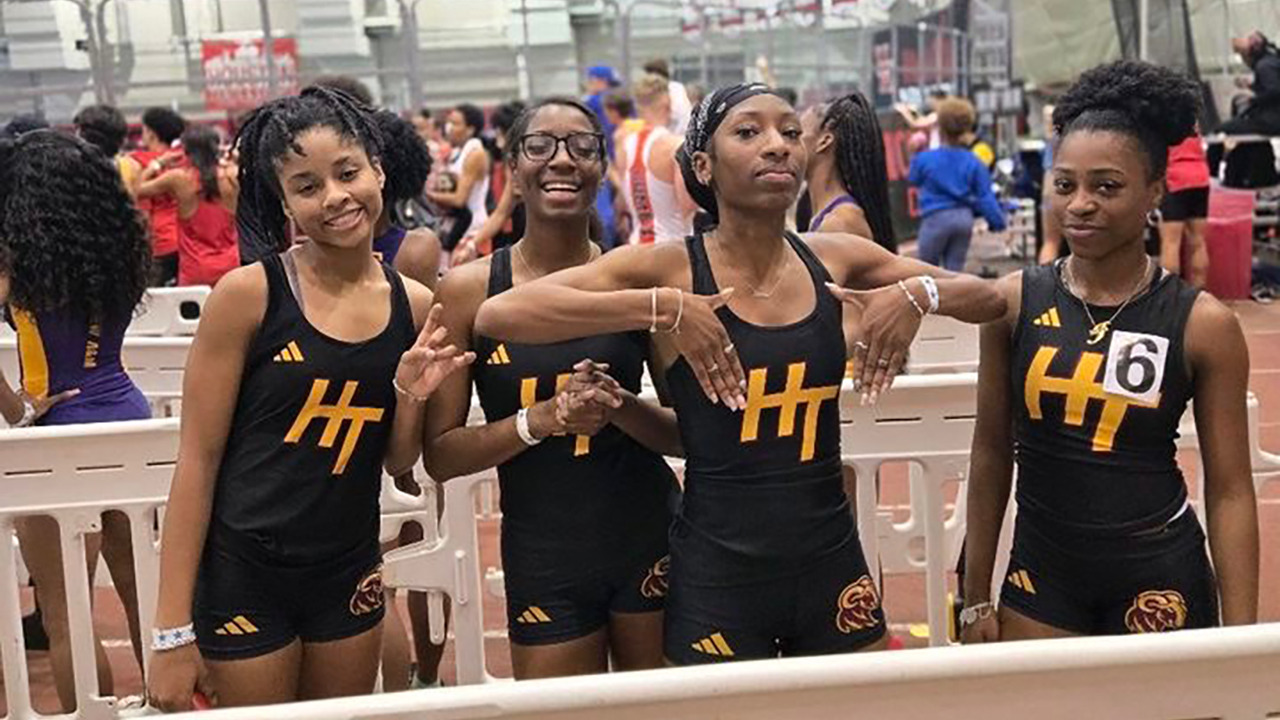 HT's women's 4-by-400-meter relay team pose for a picture at a meet earlier this season