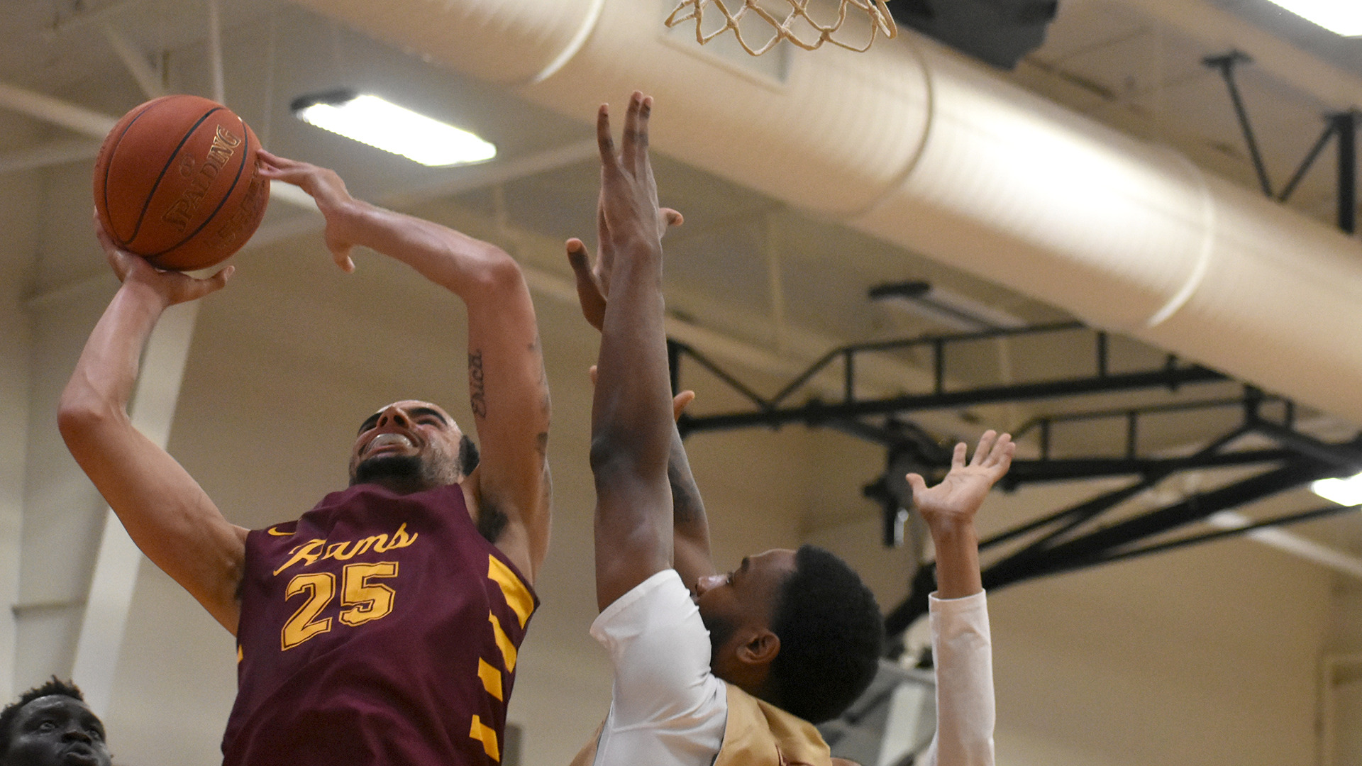 Cade Holzman goes up for a contested layup in HT's game at Texas A&M–Texarkana earlier this season