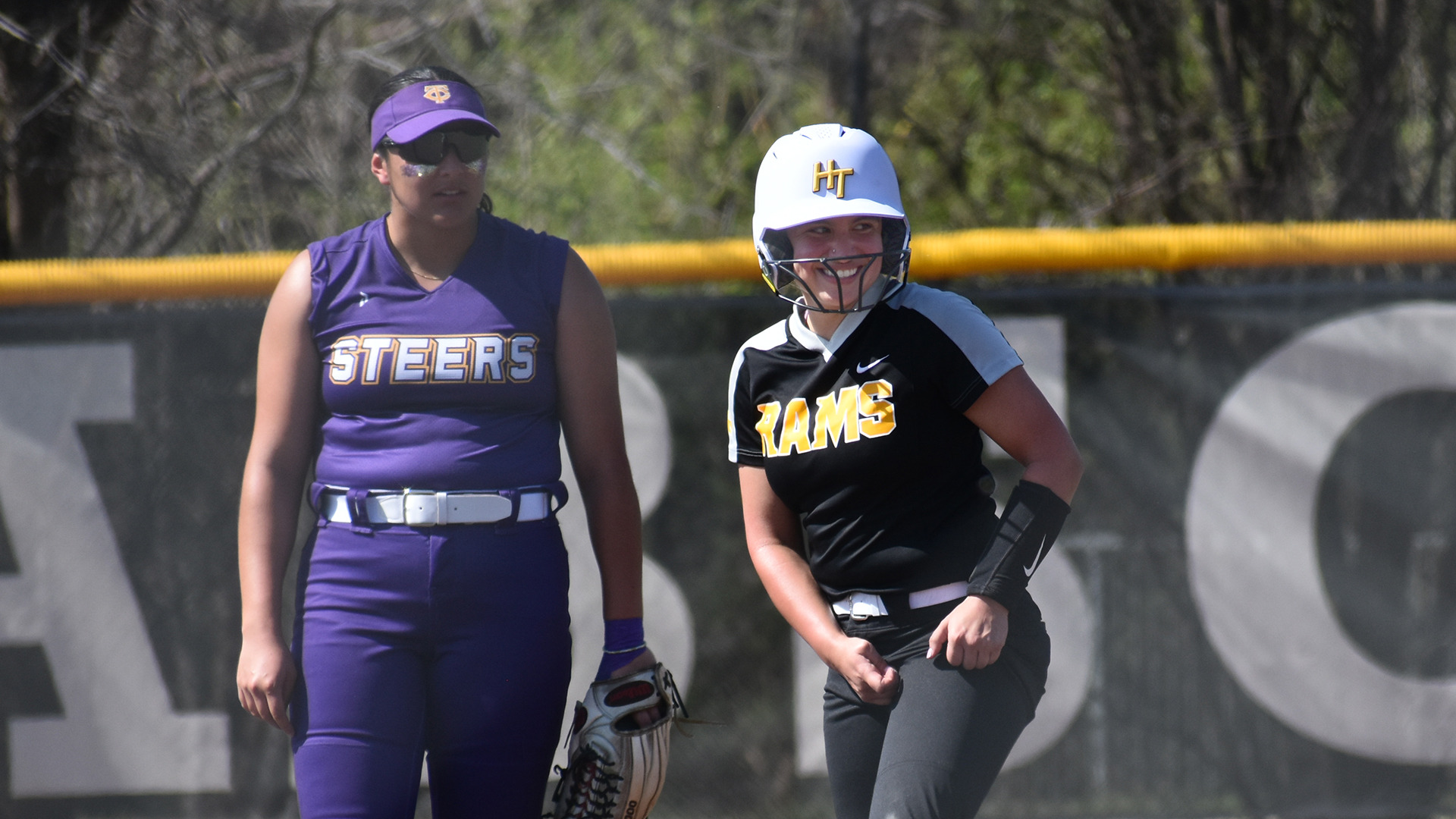 Gabby Cantu smiles at her teammates after reaching second base in HT's doubleheader against Texas College
