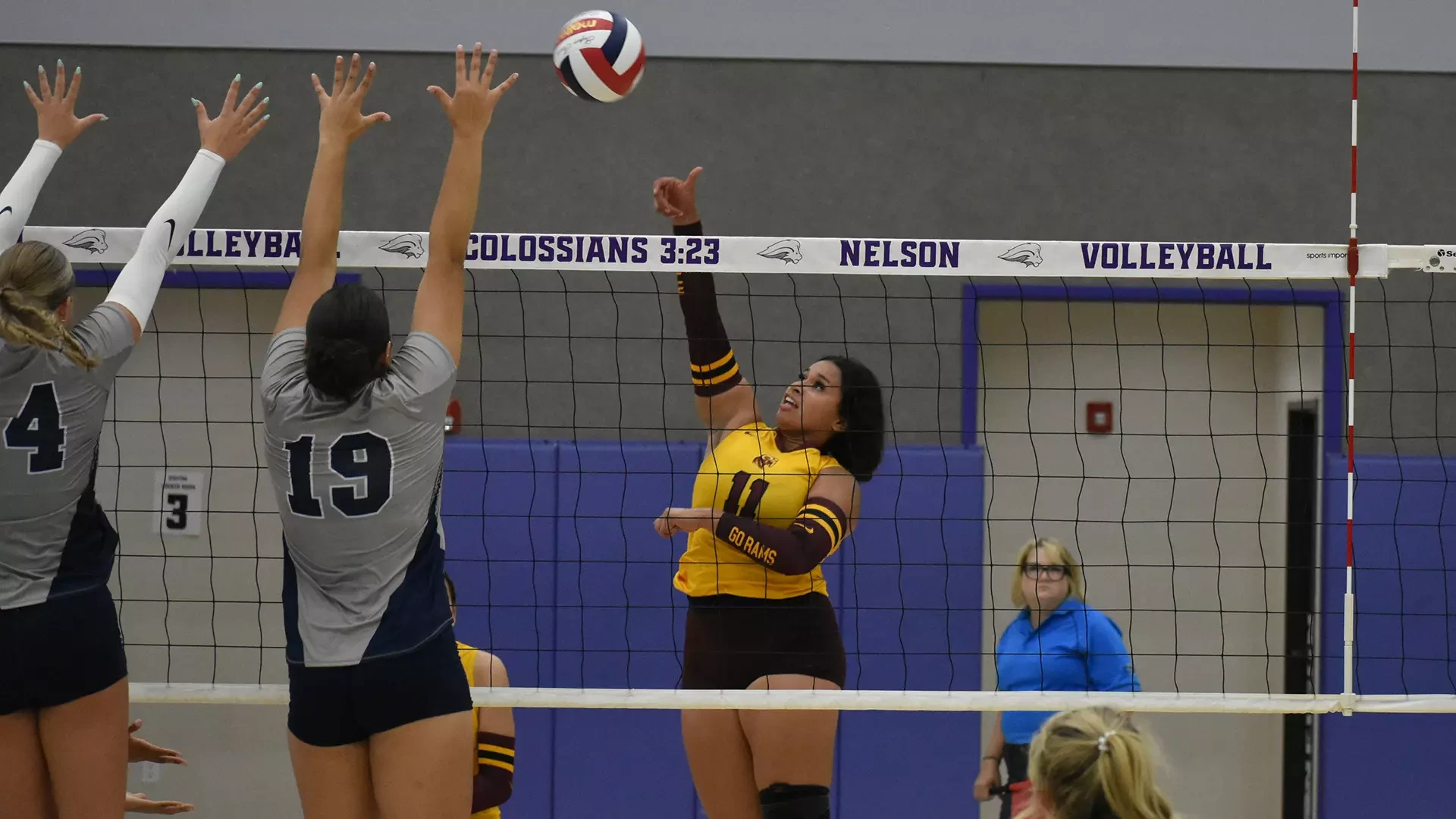 HT volleyball player Chloe Gaytan sends an attack over the net against Texas A&M-Texarkana defenders