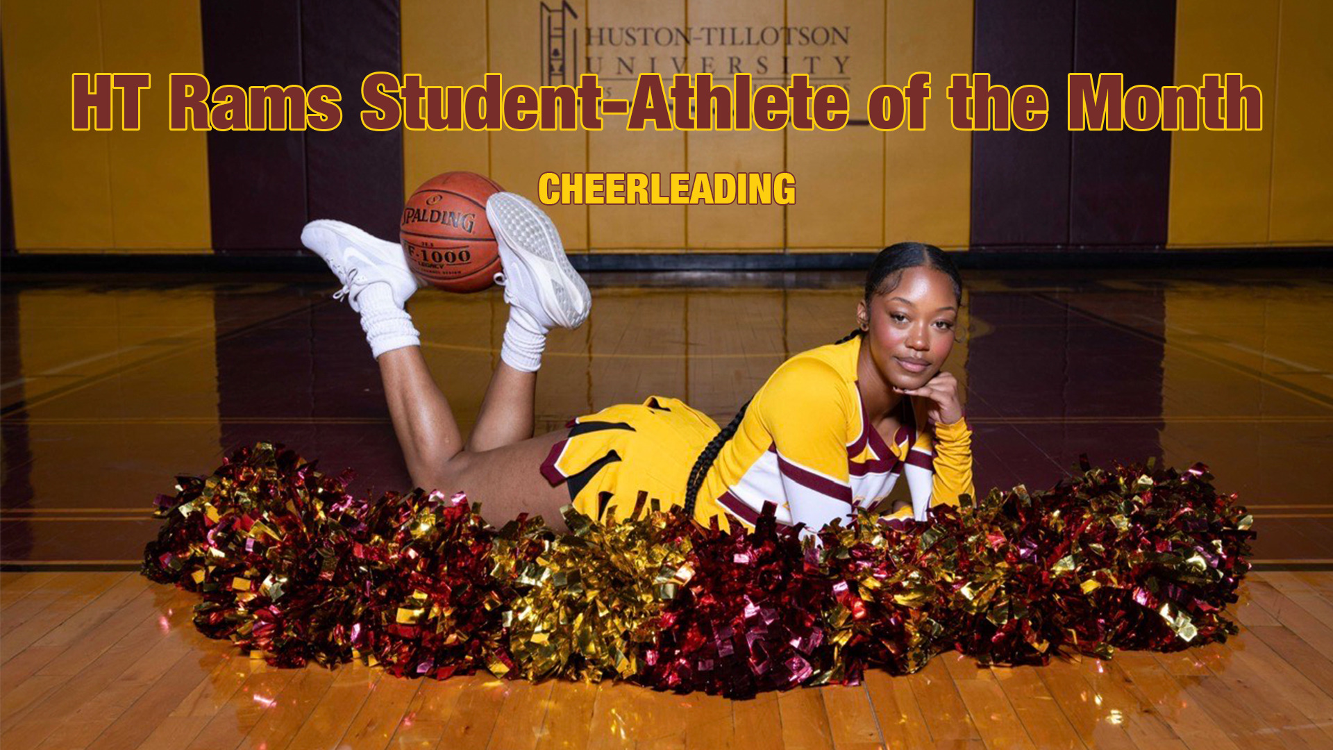 HT Rams Student-Athlete of the Month - Cheerleading. A picture of cheerleader Chloe Sutton in uniform, lying on her stomach in behind pompoms, with a basketball held in her raised feet