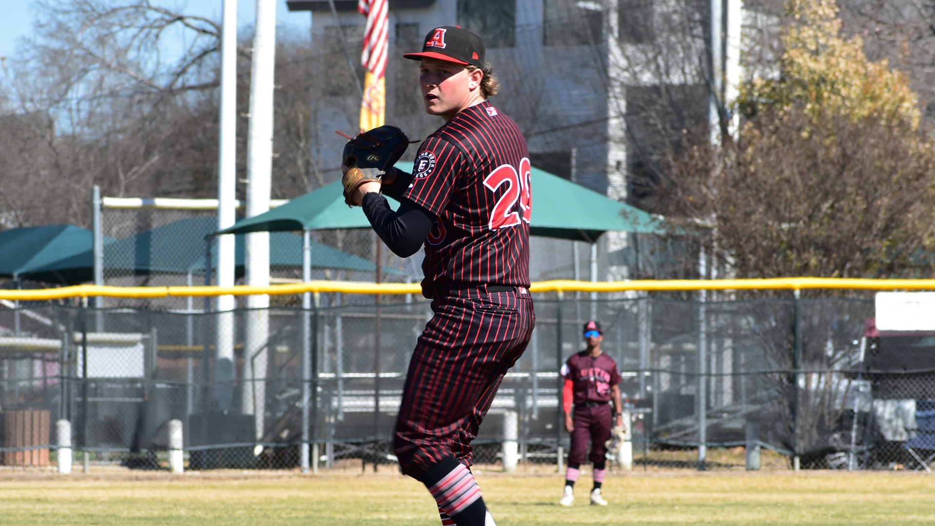 HT baseball pitcher Ethan Walker winds up for a pitch in a game early in the 2026 season