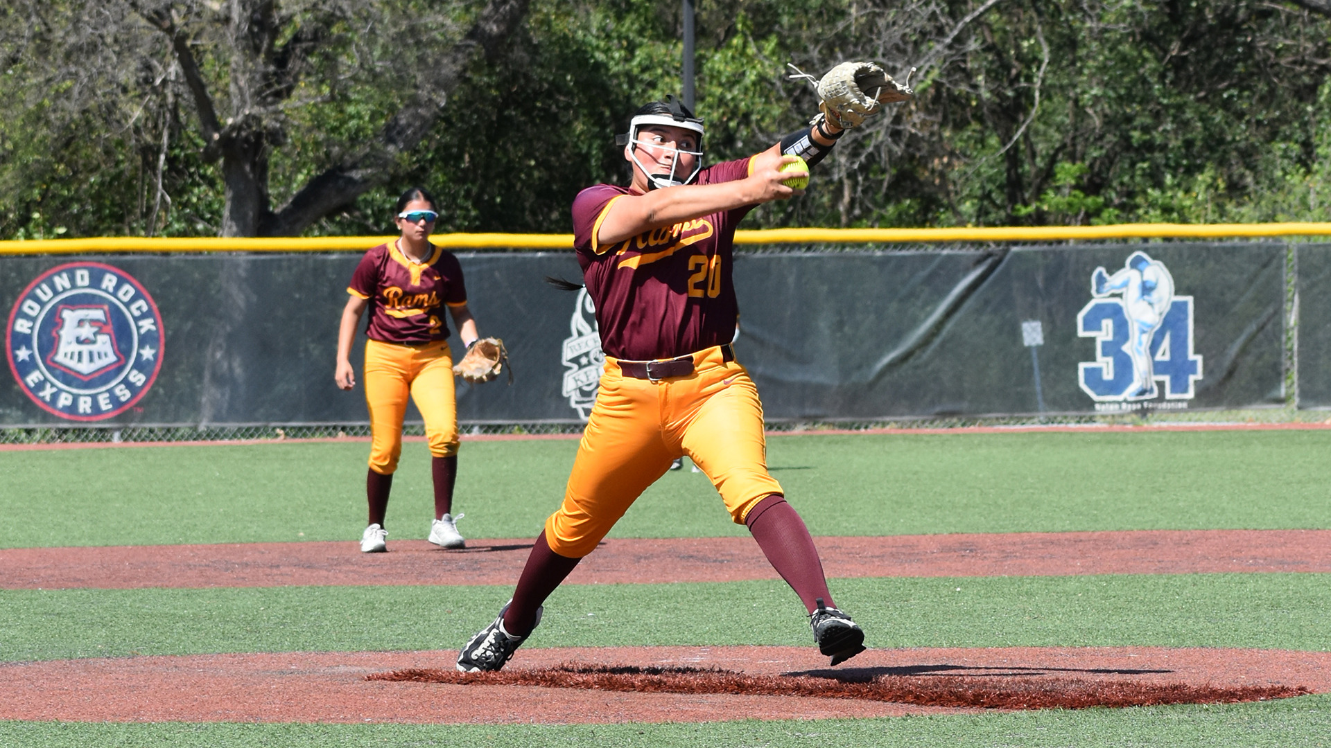 HT Softball pitcher Marleigh Robinson winds up for a pitch; Alexis Gaona, playing second base, is visible in the background.