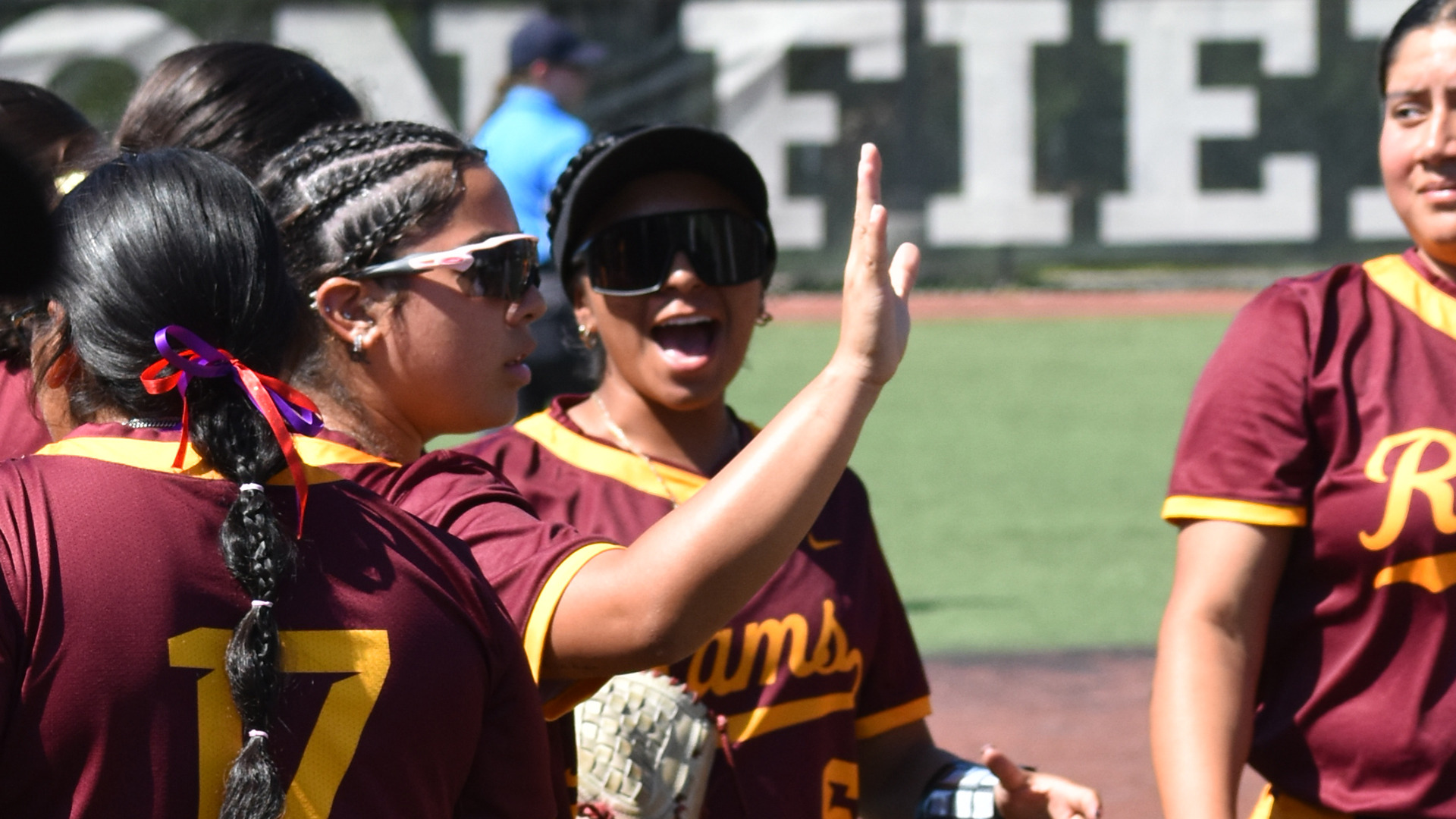 Alayali Alaniz give a high five and Isabella Roblero verbally congratulates an HT softball teammate in a home game against Rust College earlier this year.