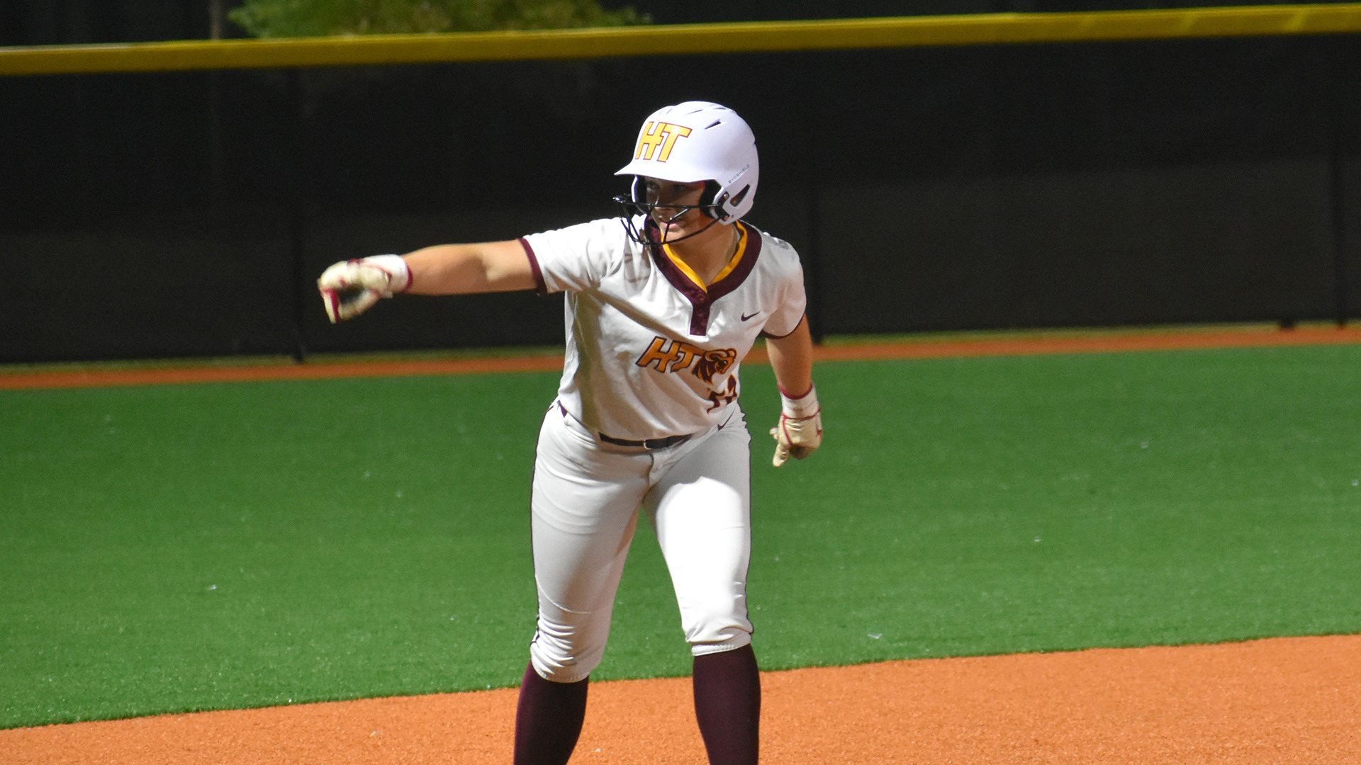 Hailey-Jane Holder points to her HT teammates in the dugout after advancing to third base in HT's HBCUAC tournament game against Rust (Miss.)