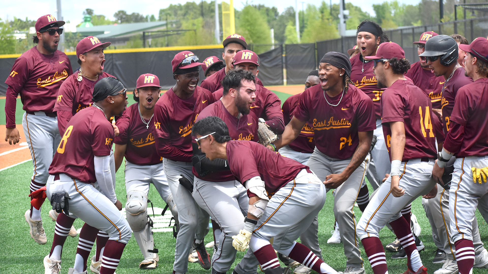 HT baseball players mob teammate Jacob Perez (in middle, without helmet or cap) after his homerun against Stillman (Ala.) in the HBCUAC tournament Sunday, April 26