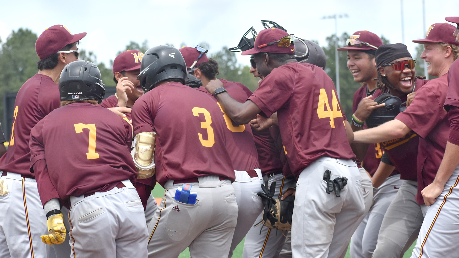 HT baseball players mob teammate Joseph Brown in celebration after his walkoff homerun against Stillman in the HBCUAC Tournament