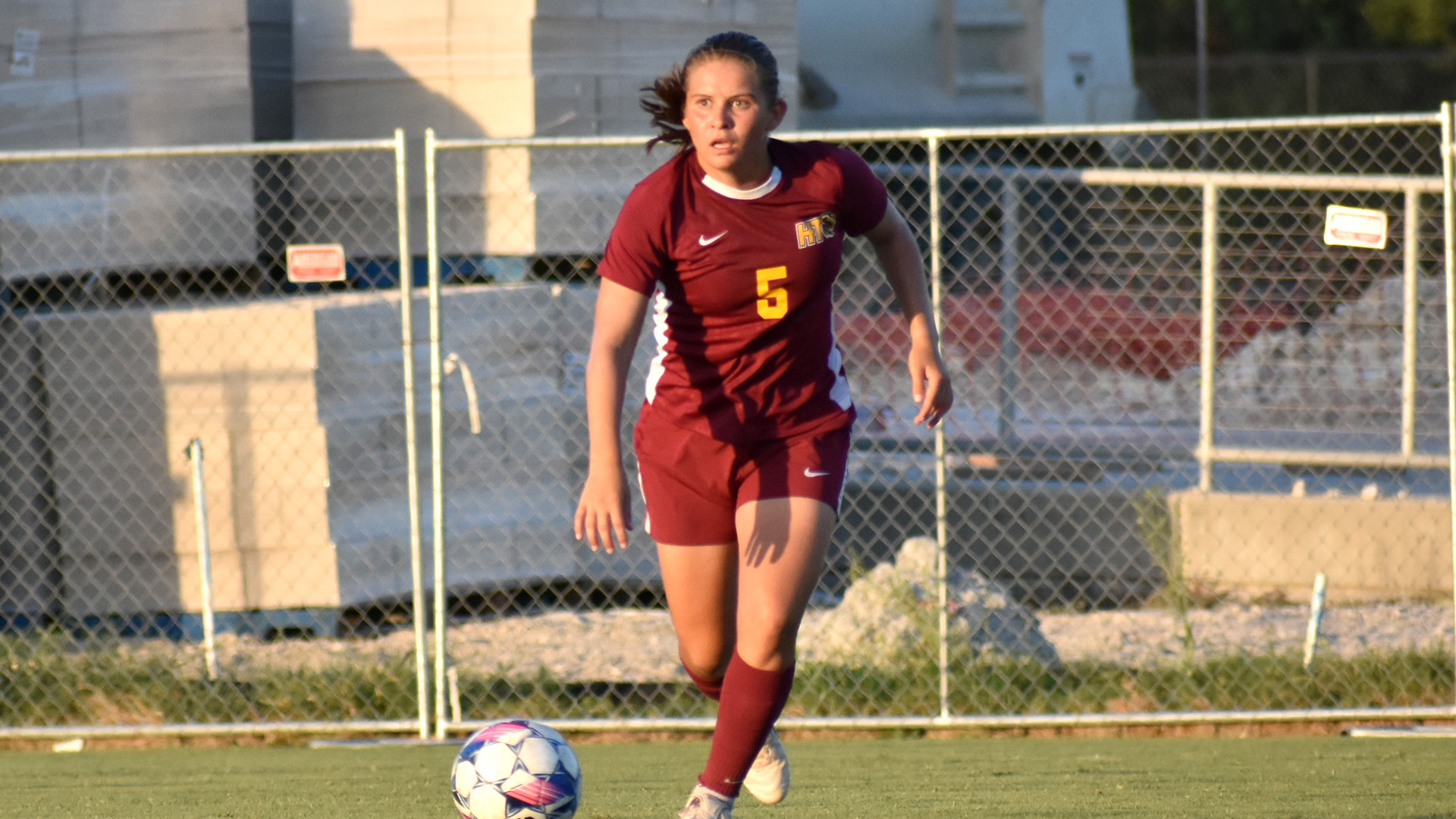 HT women's soccer player Kiara Leiton Amador looks for a teammate to pass to in a preseason game