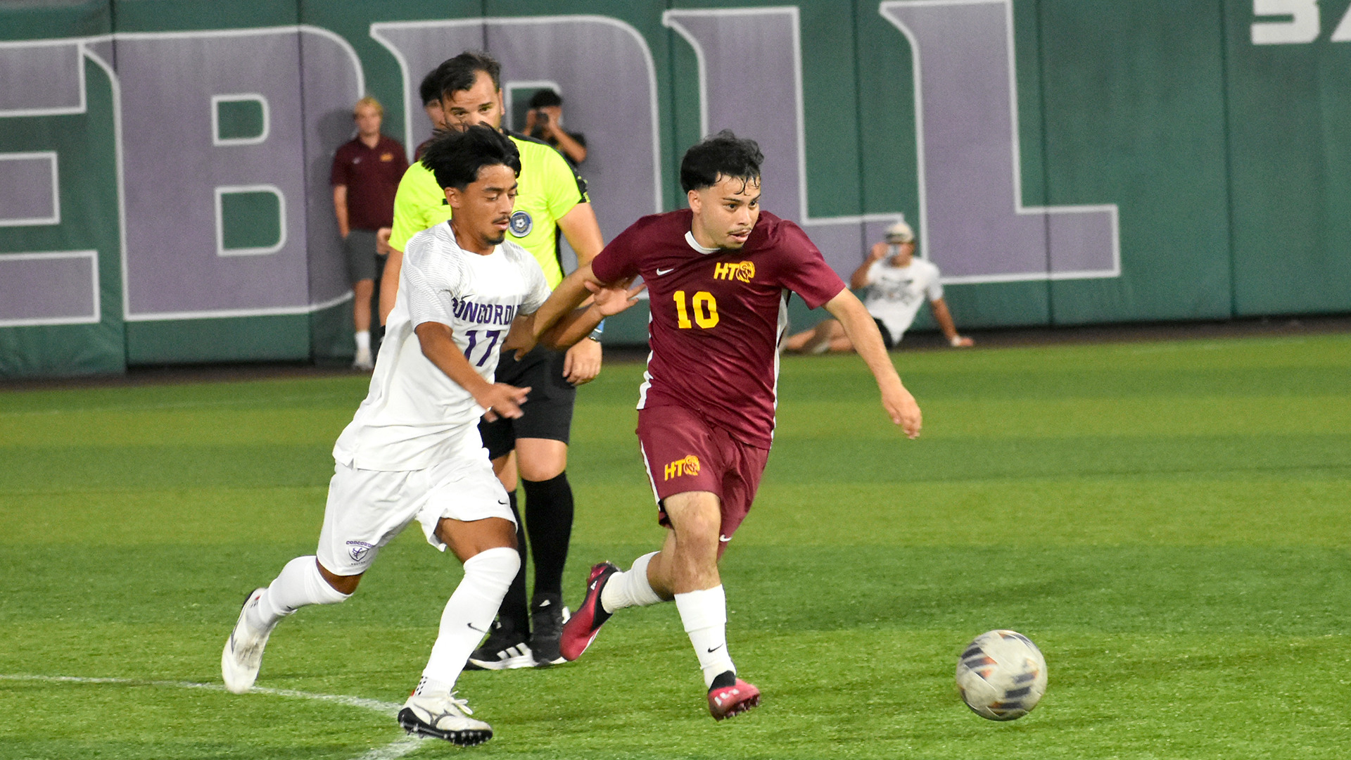 HT men's soccer player Manuel Guevara dribbles away from a Concordia defender