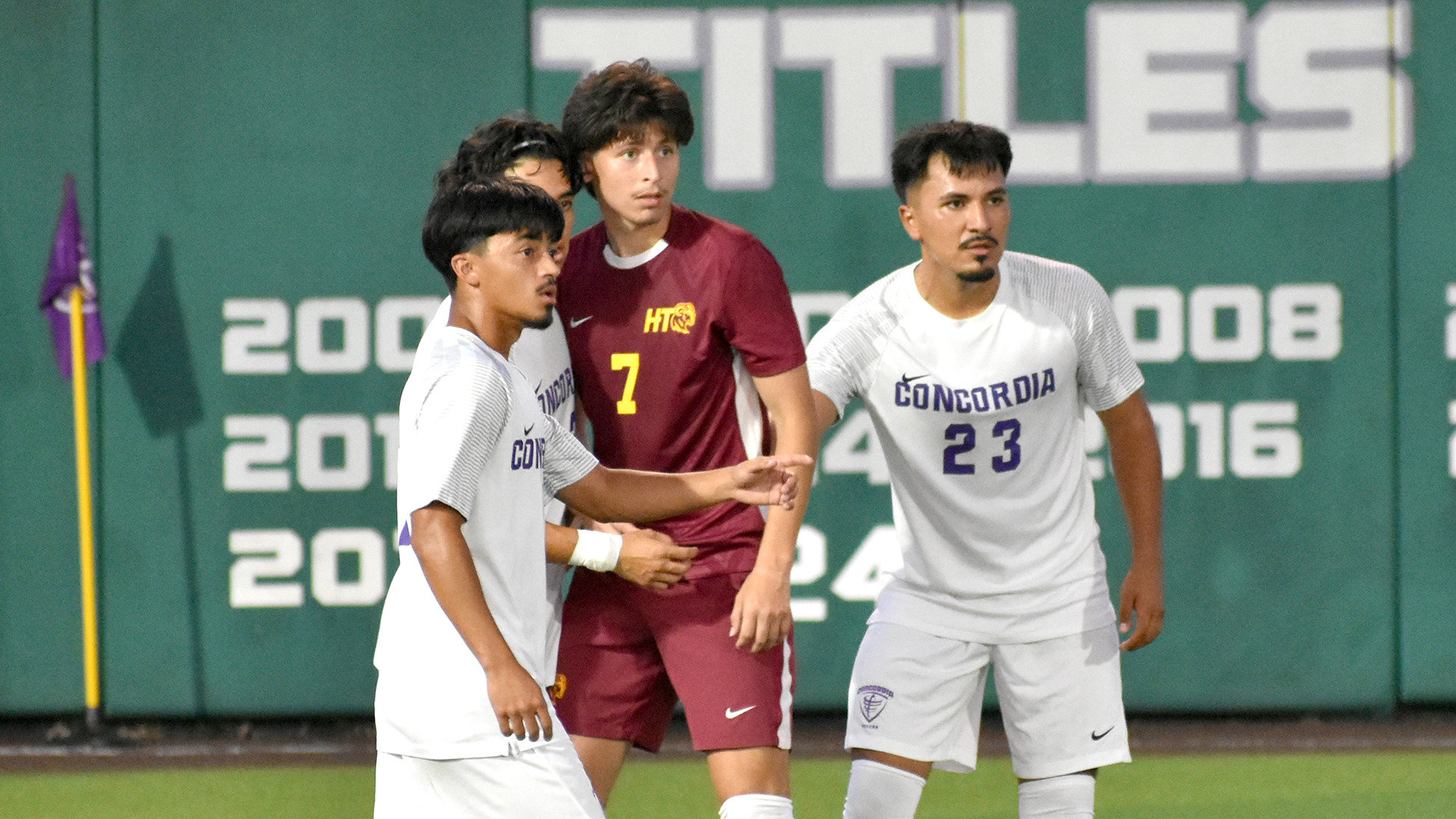Jaylen Melendez (7) prepares for a teammate's free kick while surrounded by Concordia defenders