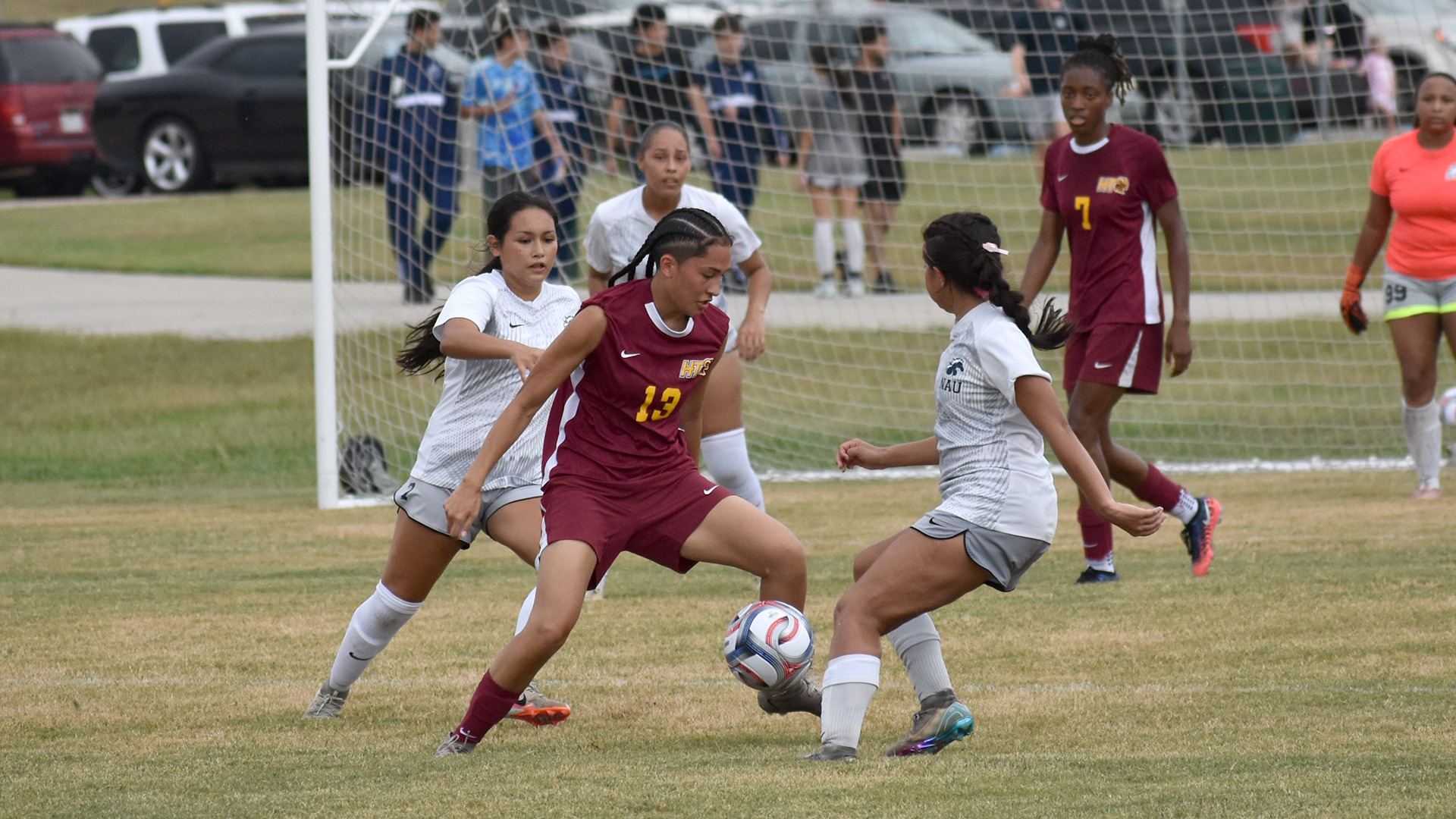 HT women's soccer player Emili Taclibon takes control of the ball through three North American defenders in game Sept. 3, 2026