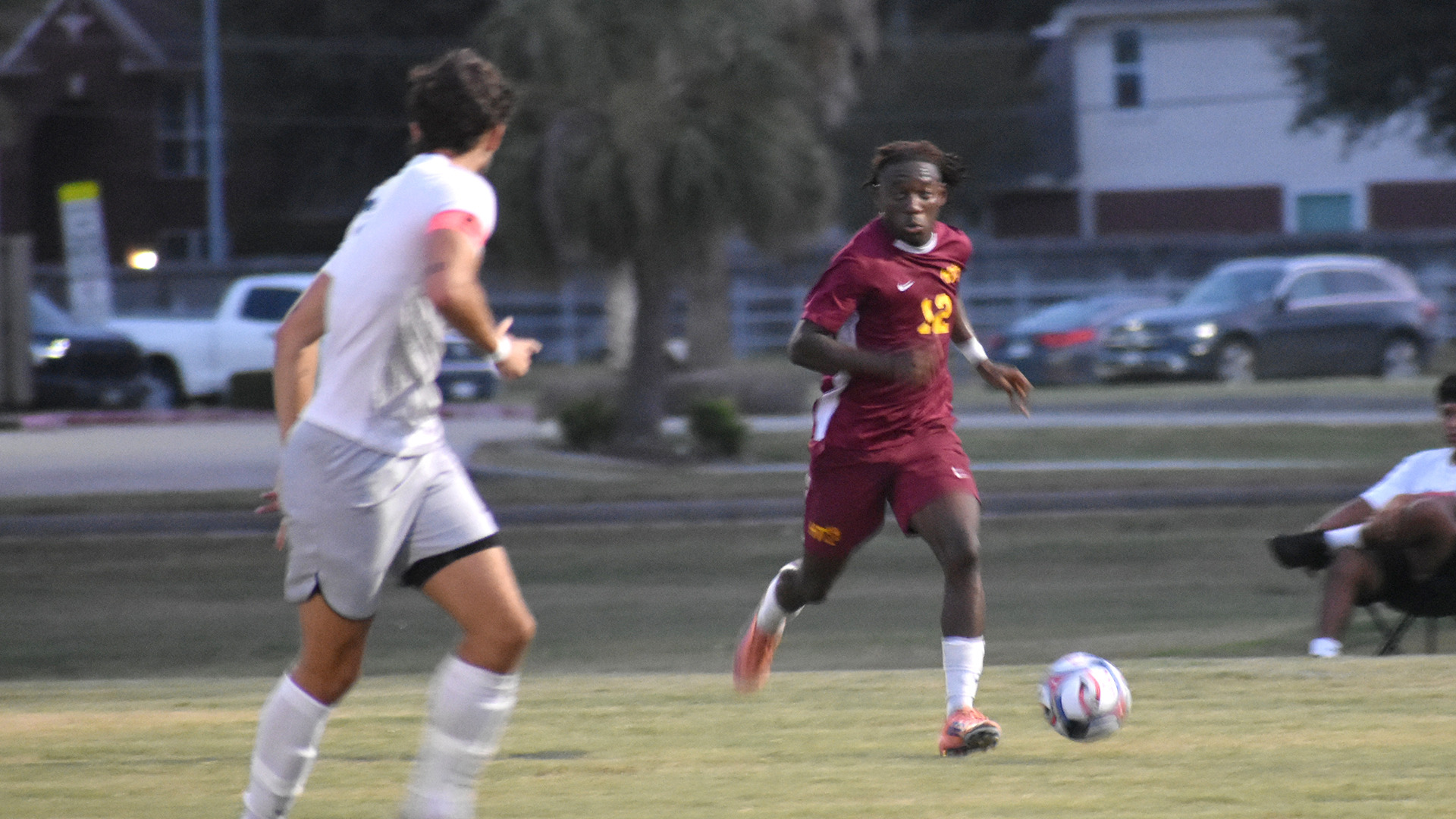 HT men's soccer player Joel Prince Kisukulu dribbles upfield against a North American defender in a match Sept. 3, 2026