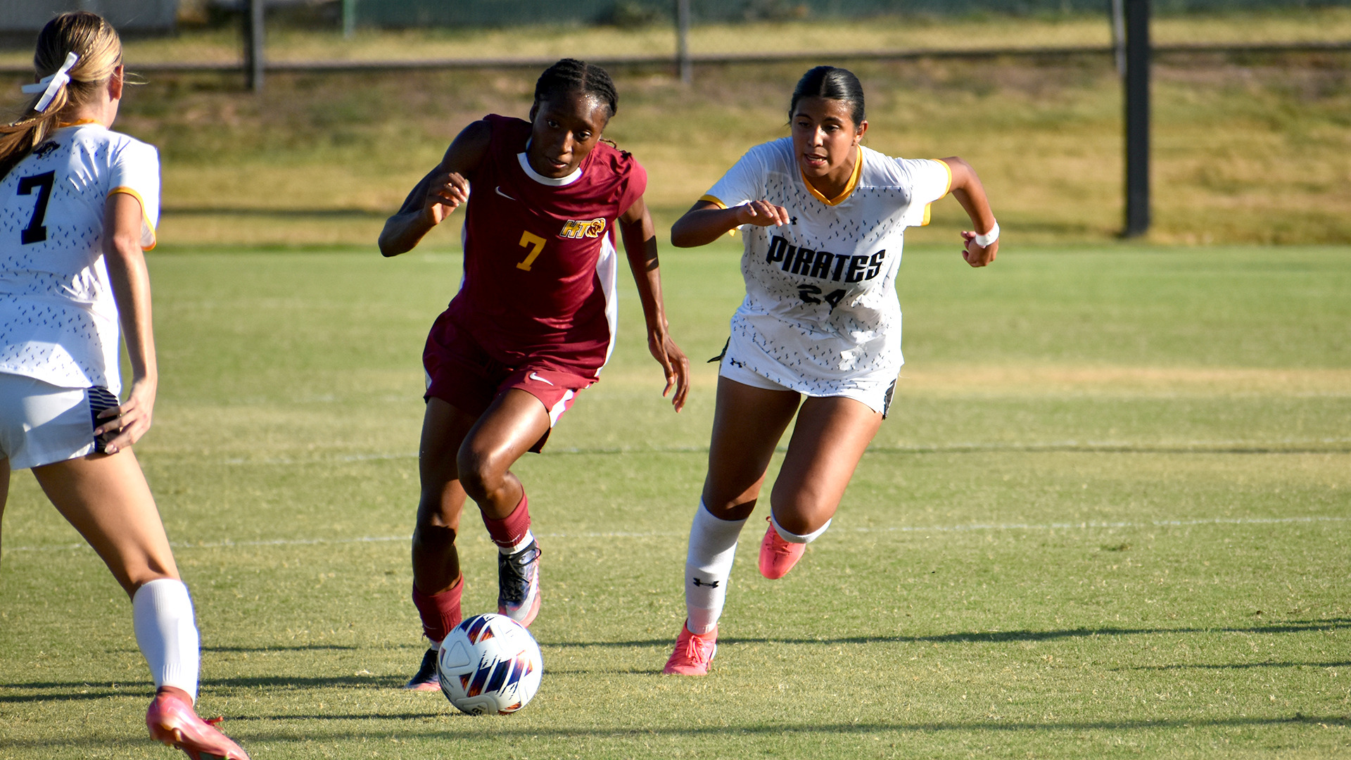 HT women's soccer player Mariyah McCrae dribbles through two Southwestern defenders in a match on Sept. 1, 2026