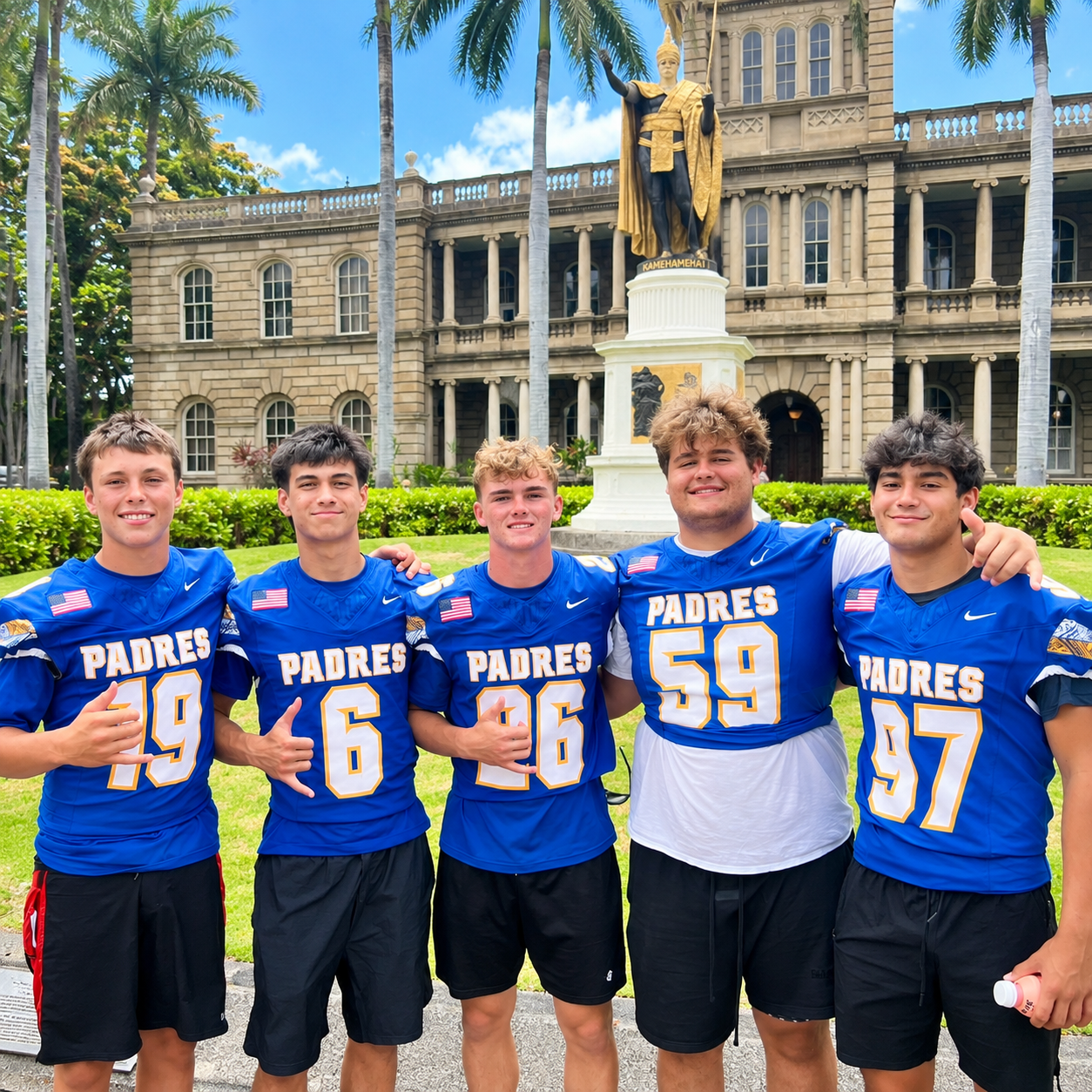 football players in front of fountain in Hawaii