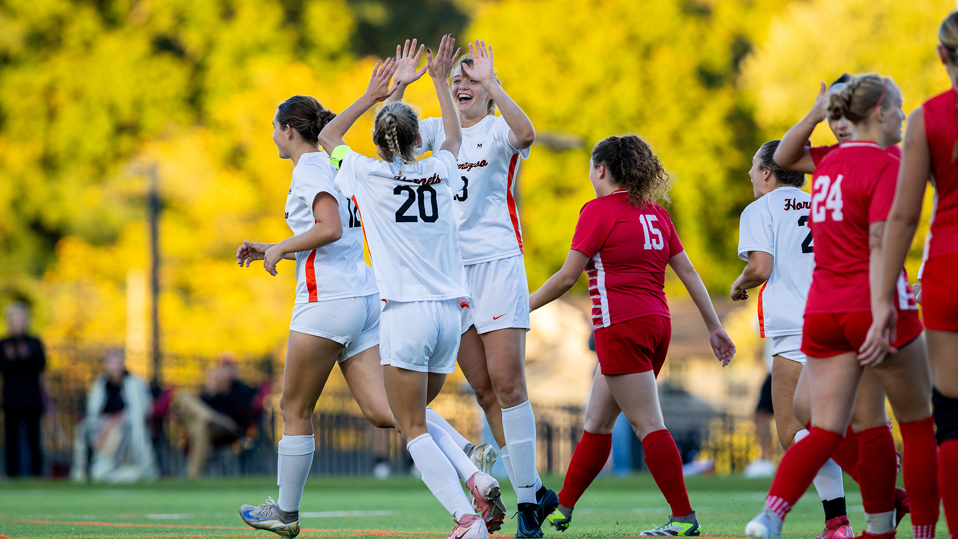 Ruby Hogan and Elle Bernas celebrate a goal