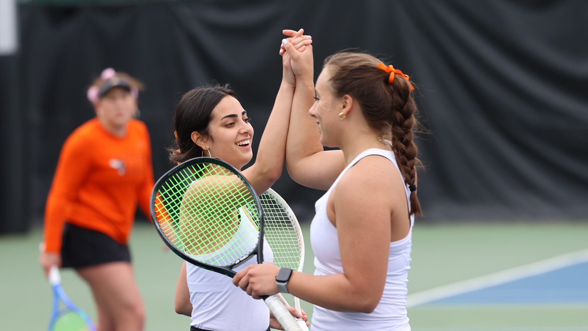 Rebecca Elias and Peja Liles celebrating on the tennis court