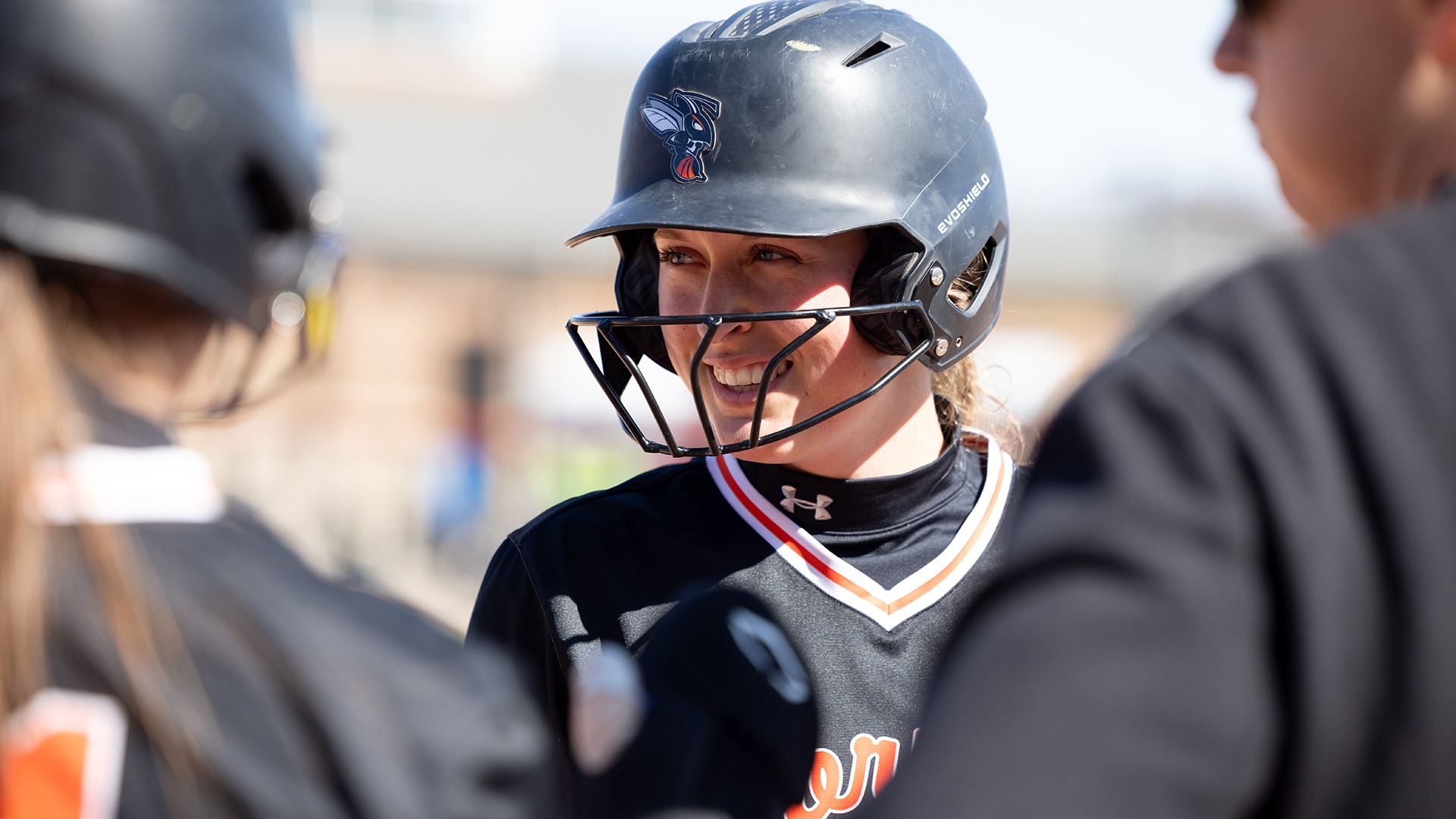 Brenna Fisher playing softball