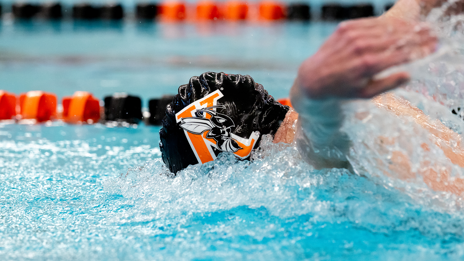 A Kalamazoo College swimmer swimming