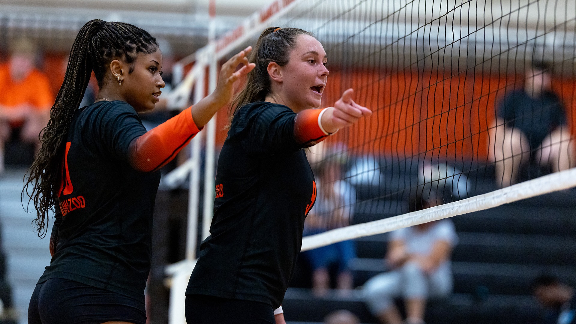 Quaneice Dillard and Savannah Chapie playing volleyball