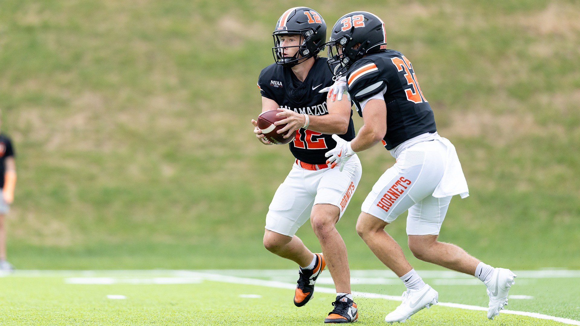 Brayden Ledin and Kyler Maiorana playing football