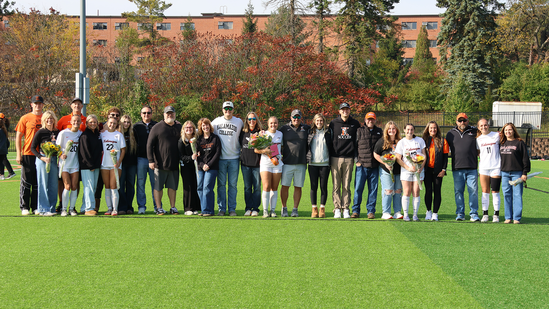 The Kalamazoo College women's soccer senior class of 2027 with their families on MacKenzie Field
