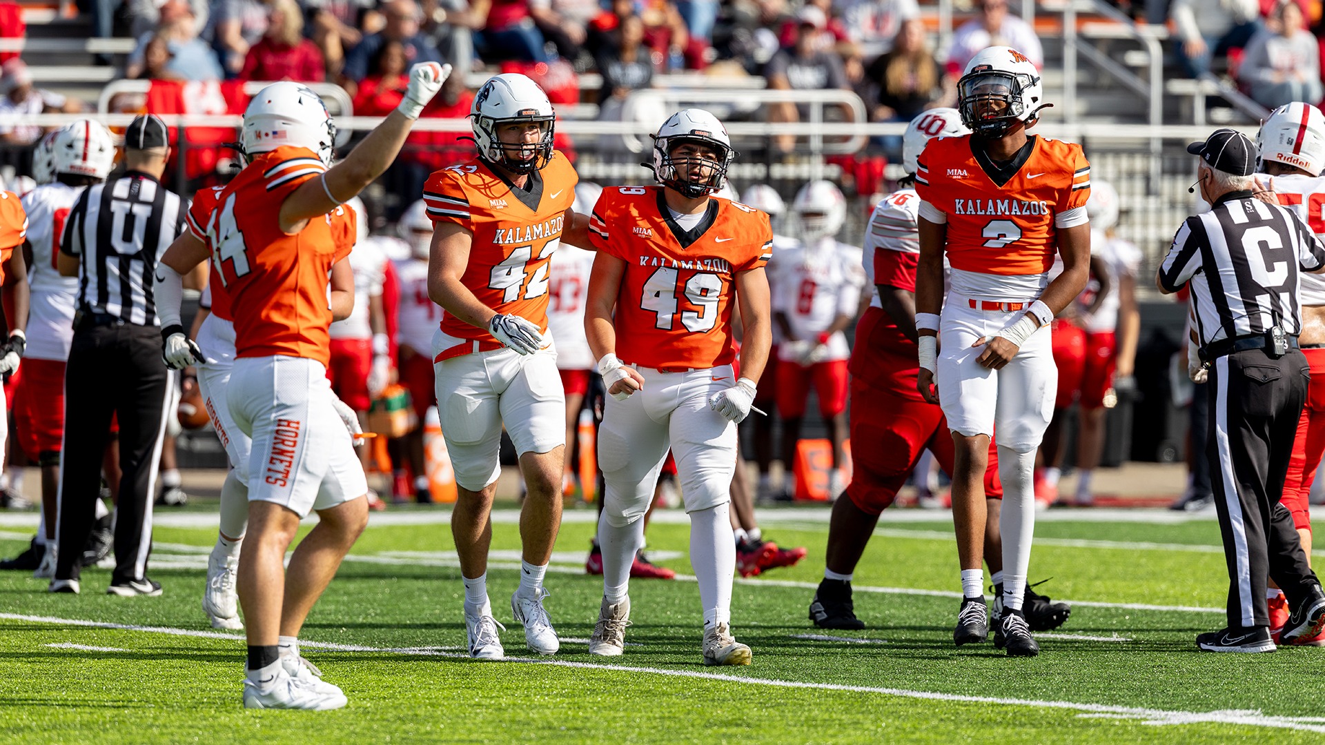 Kalamazoo College football players on the field