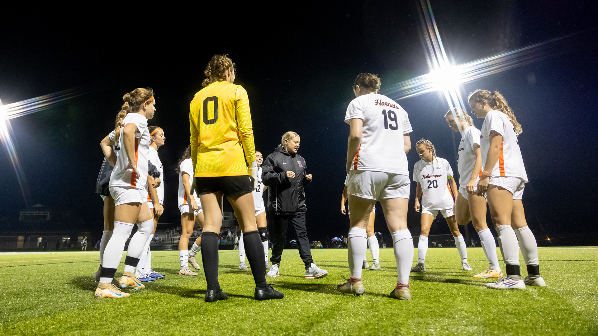 The Kalamazoo College women's soccer team huddled around head coach Jill Leibforth