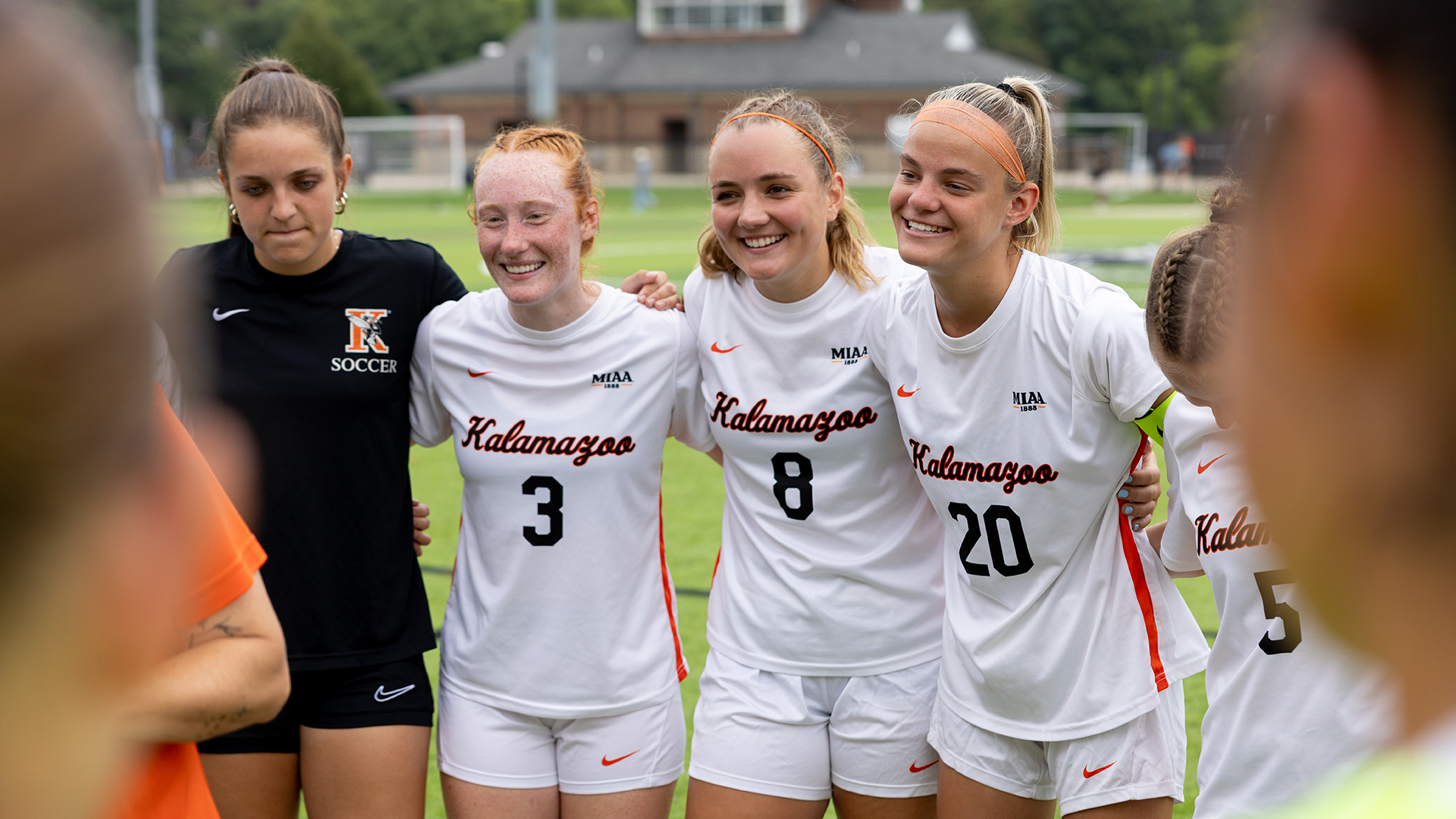 The Kalamazoo College women's soccer team huddled on MacKenzie Field