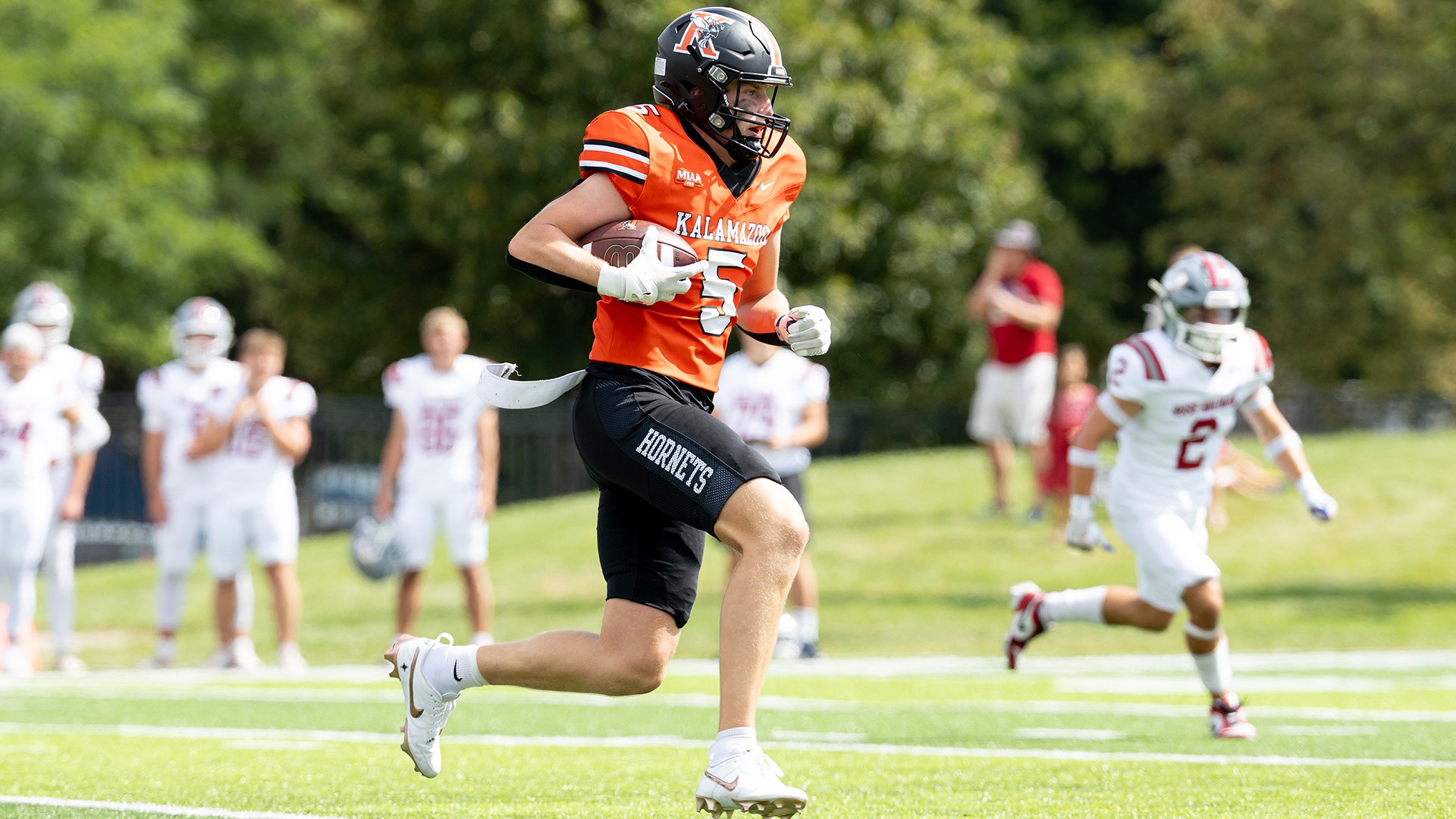 Carsen Moat playing football