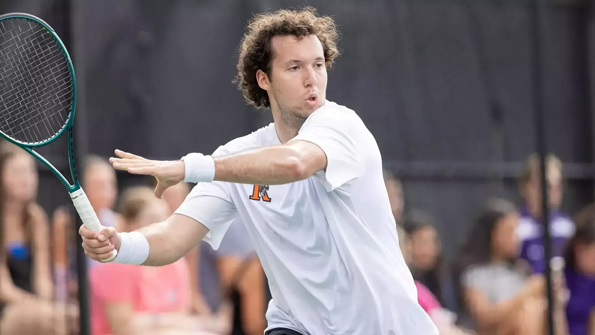 Tom Clark playing tennis