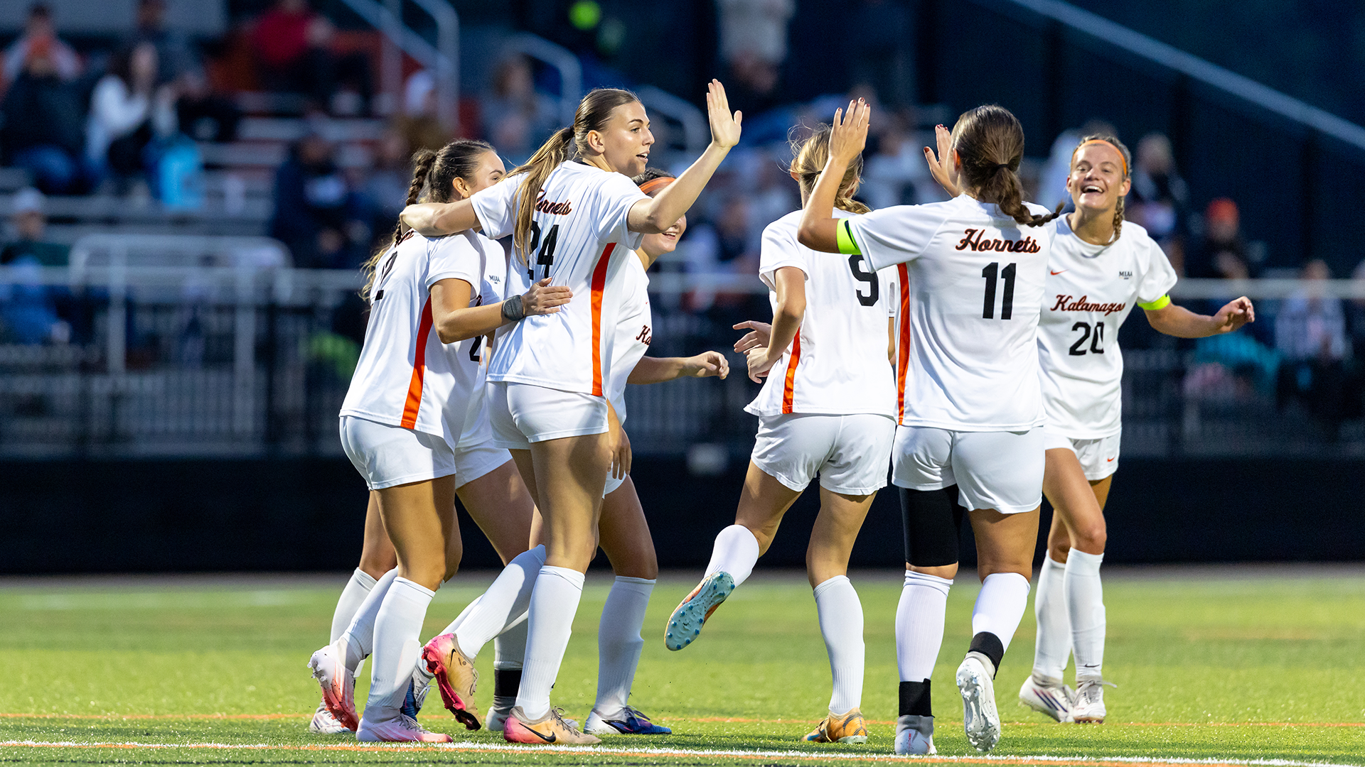 The Kalamazoo College women's soccer team celebrating a goal