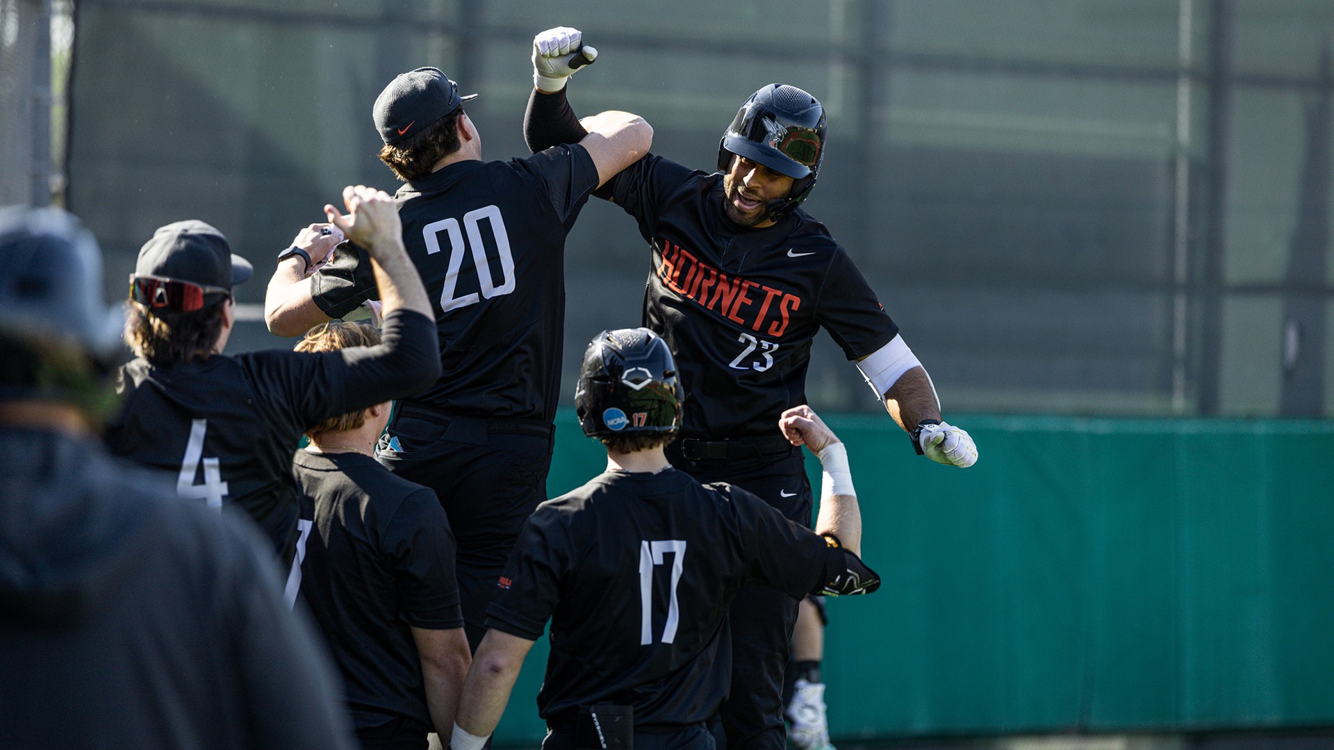 Robert Newland and the Kalamazoo College baseball team celebrating