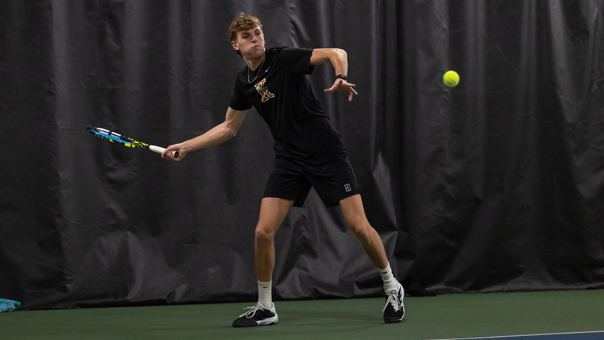 Cameron Crosby playing tennis