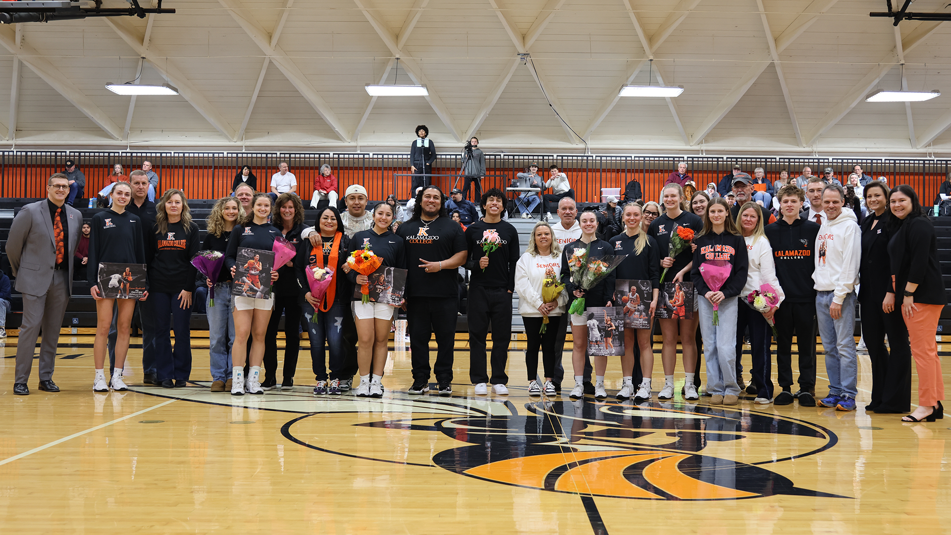 Kalamazoo College Women's Basketball 2025-26 seniors and their families on Tish Loveless Court