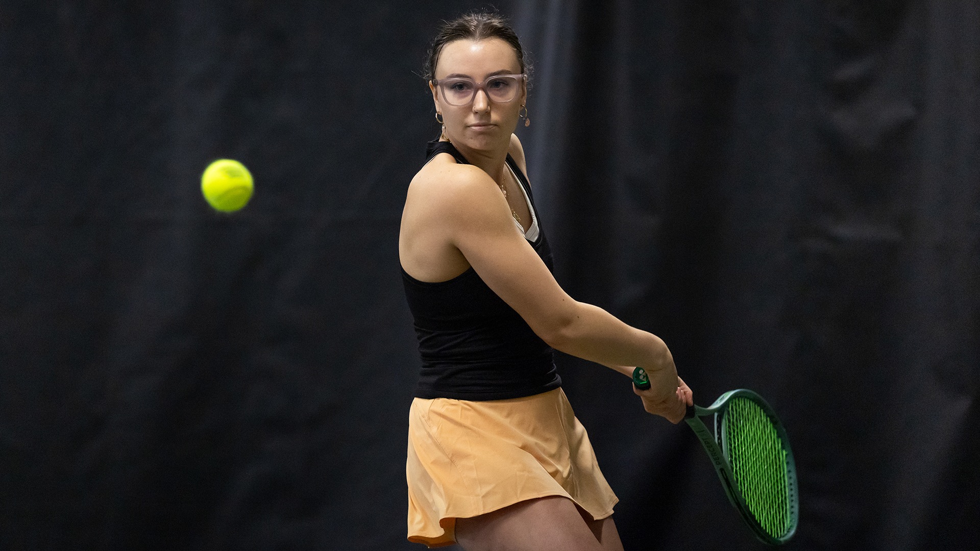 Addison Lyons playing tennis