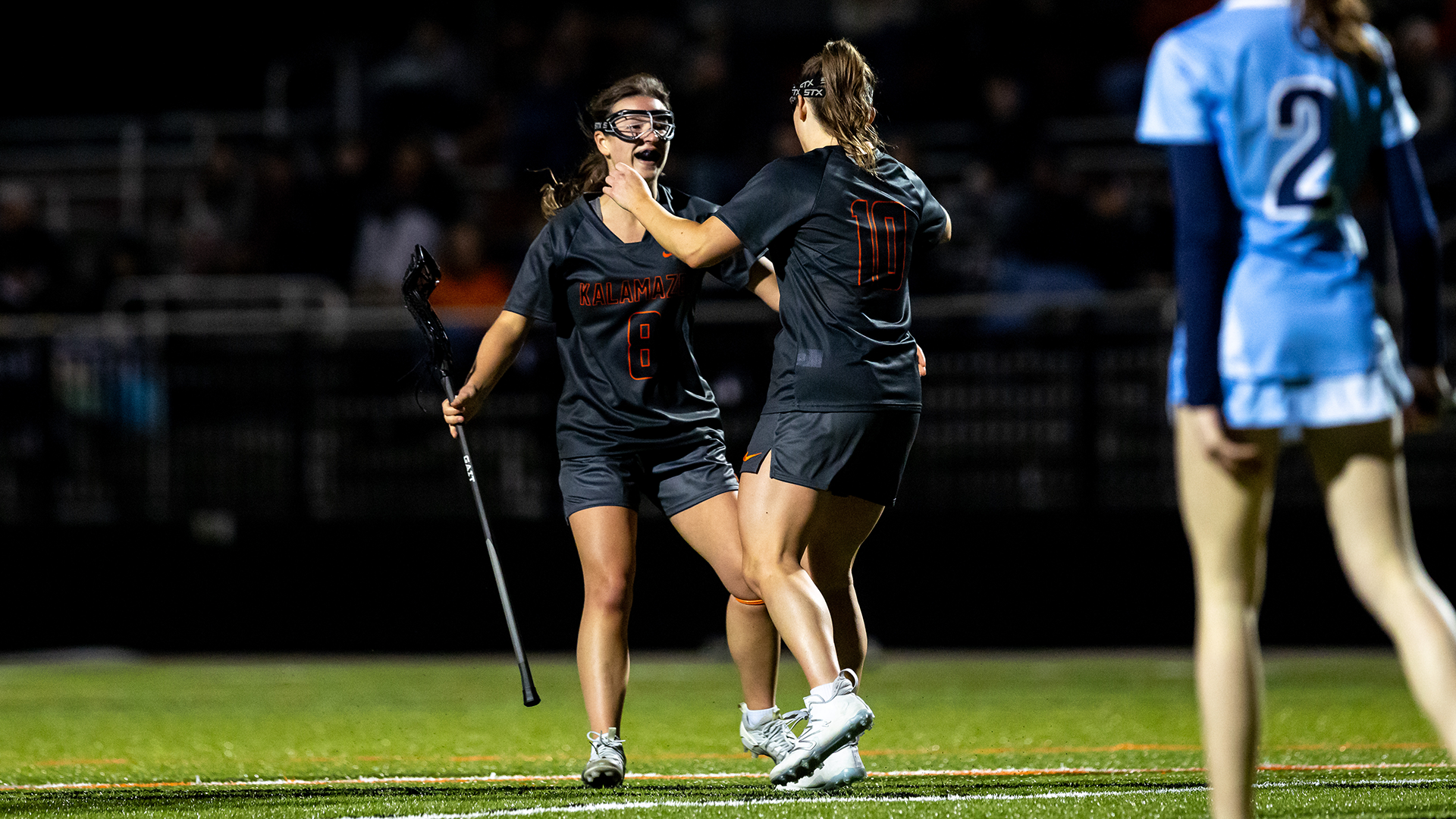 Sophie Hartl and Ella Spooner celebrate a goal