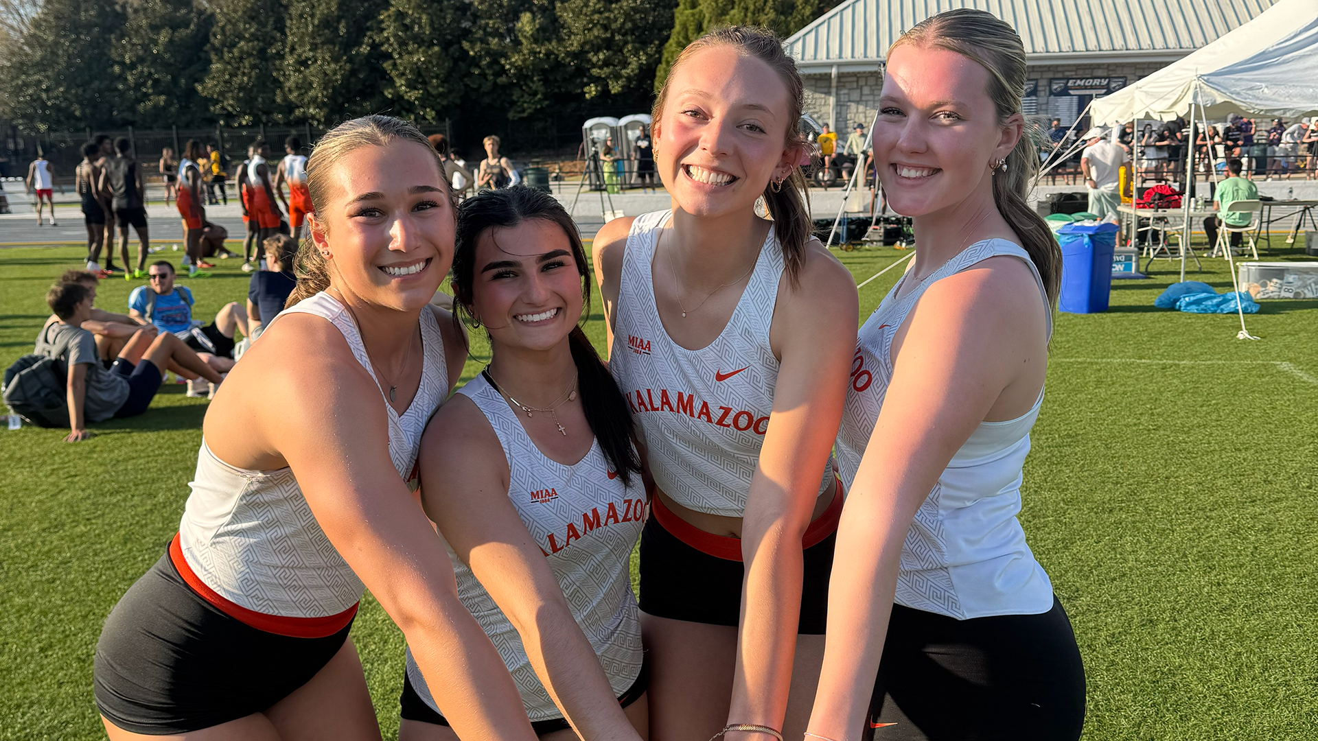 Gwyneth Dunaway, Aelitta Kazarov, Ava Bechler and Norah Reber holding a baton at the Emory Spring Break Classic