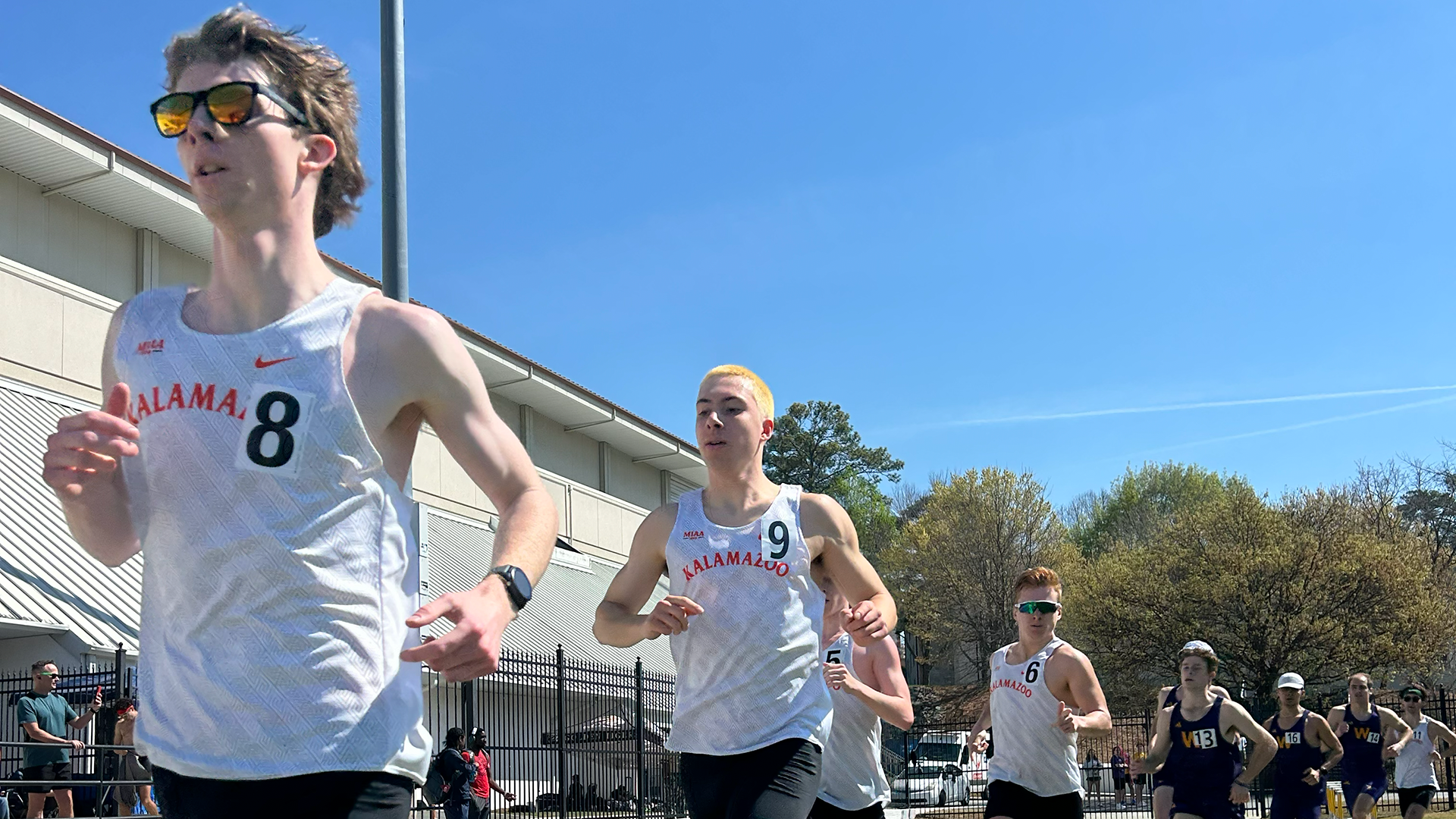 Jack Schneider, Drew Abbott and John Lonsway running track