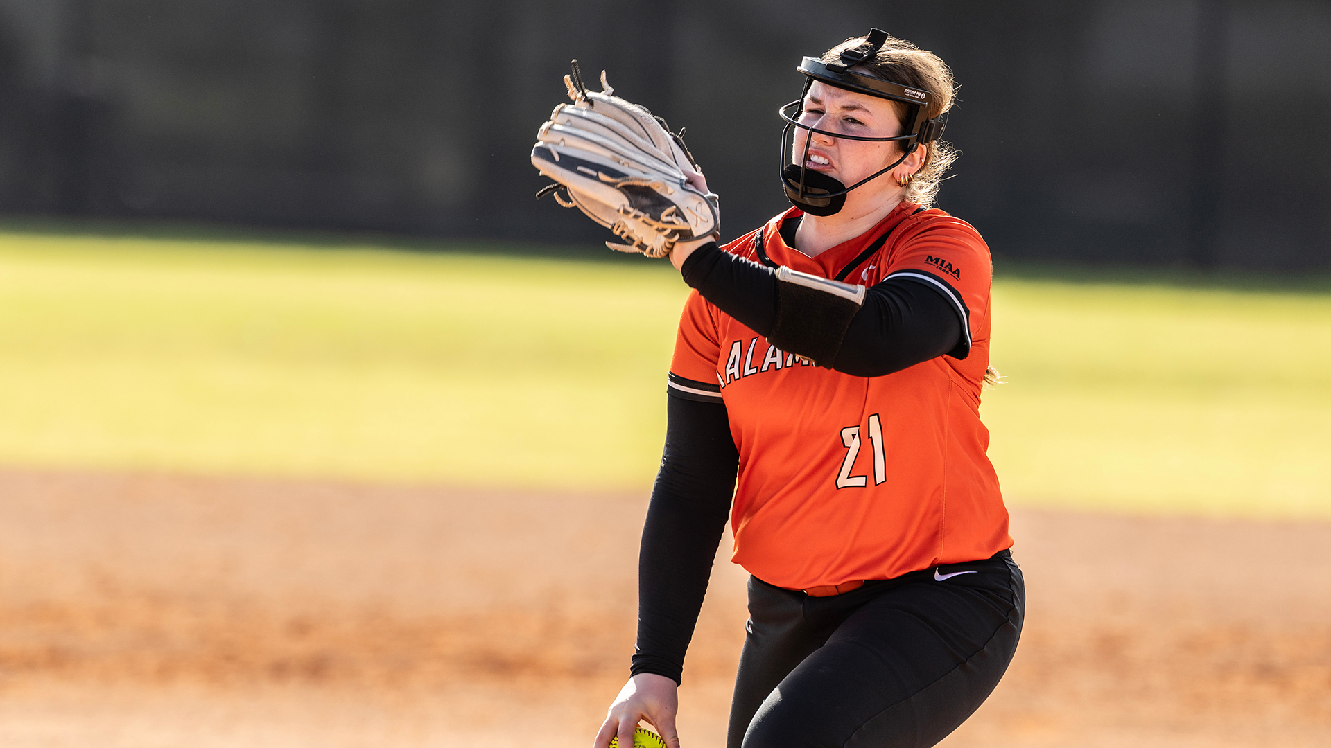 Maddie Potts pitching a softball