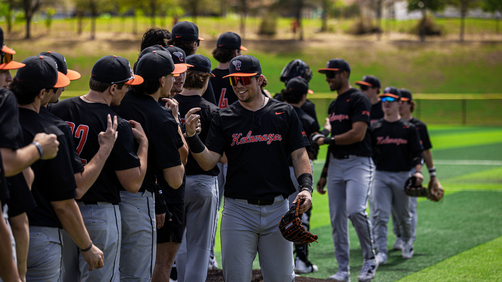 The Kalamazoo College baseball team celebrating a win