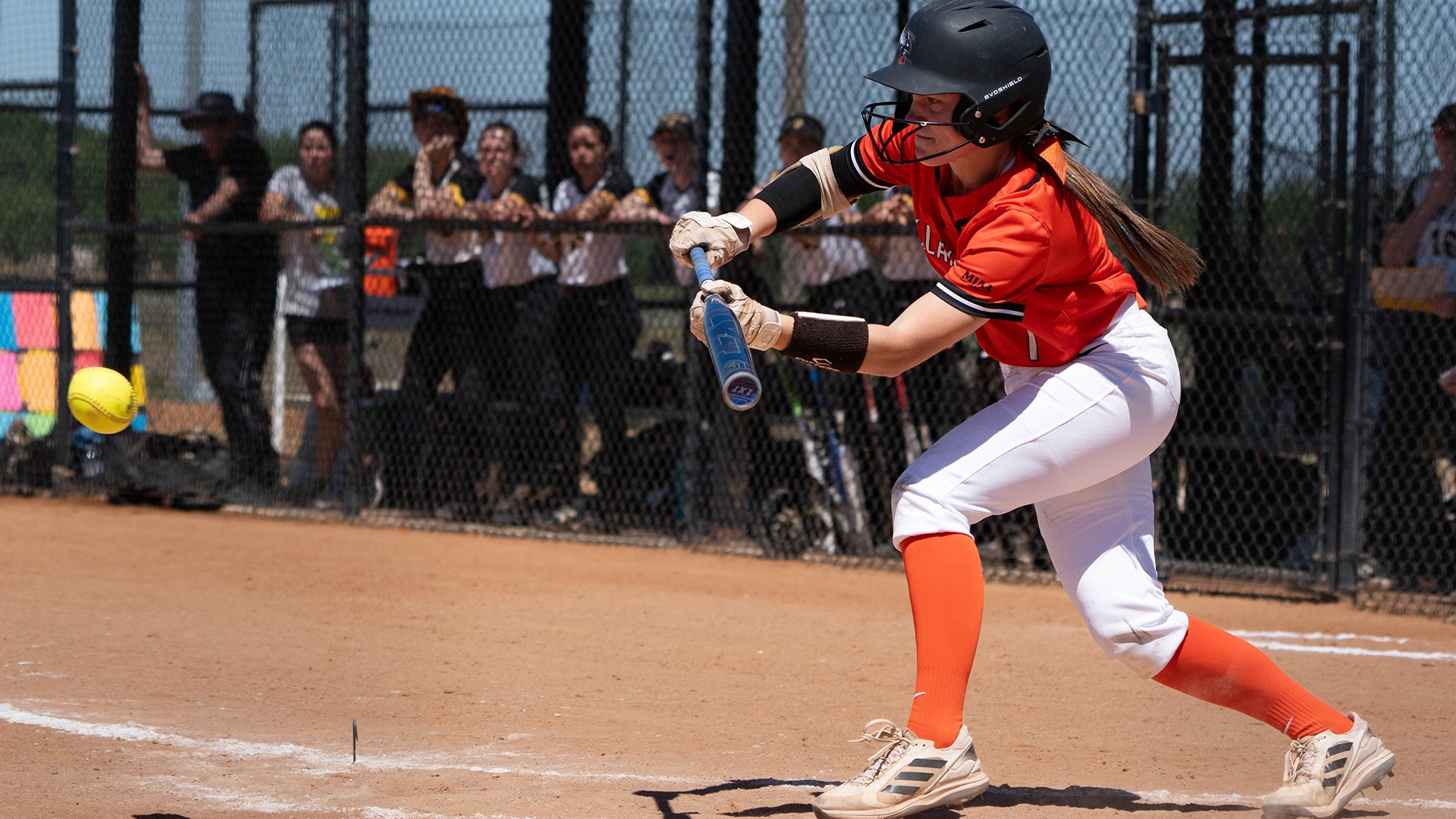 London Rabb playing softball