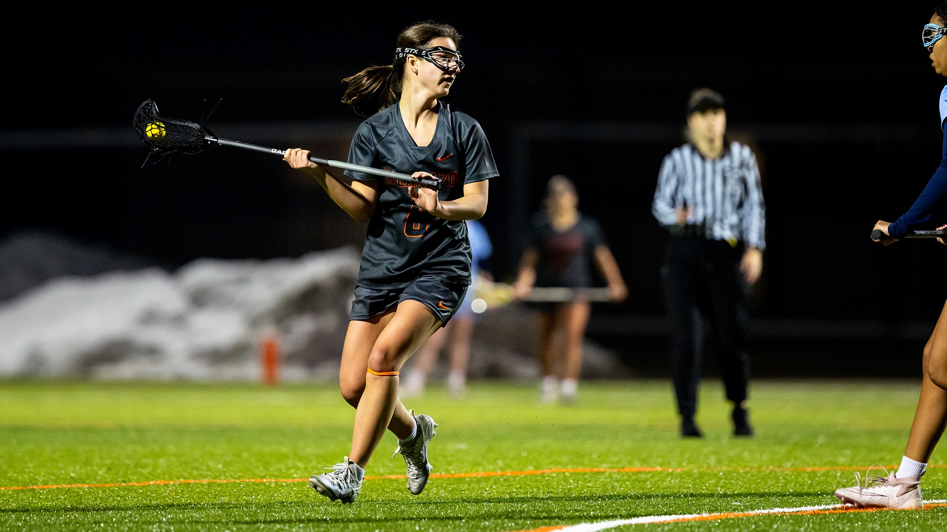 Sophie Hartl playing lacrosse