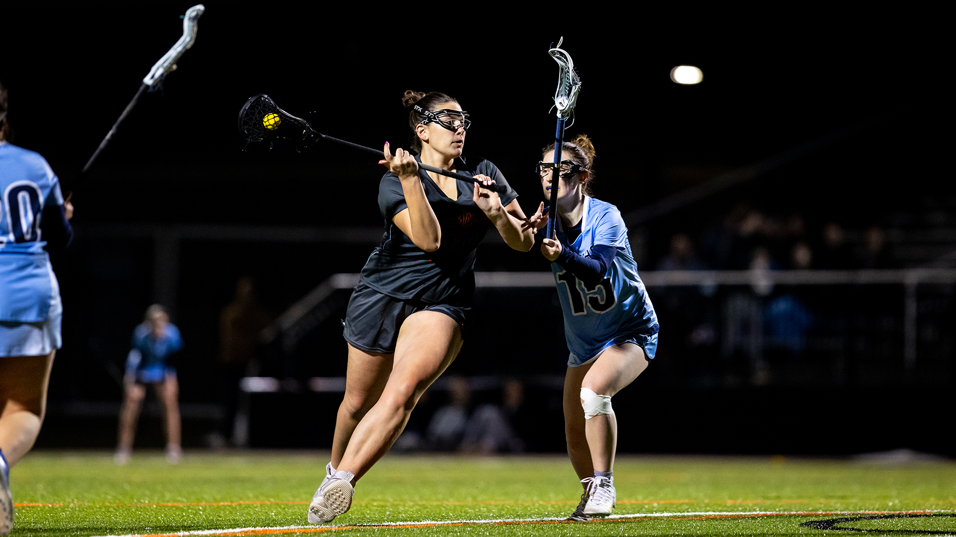 Abbie Caza playing lacrosse