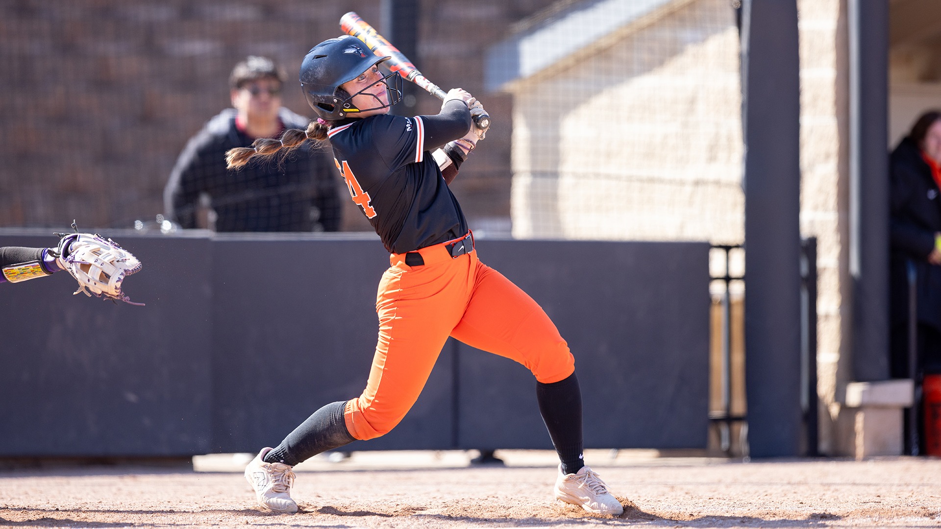 Emma Newlove playing softball