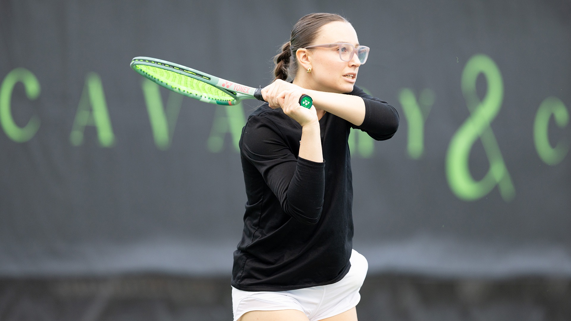 Addison Lyons playing tennis