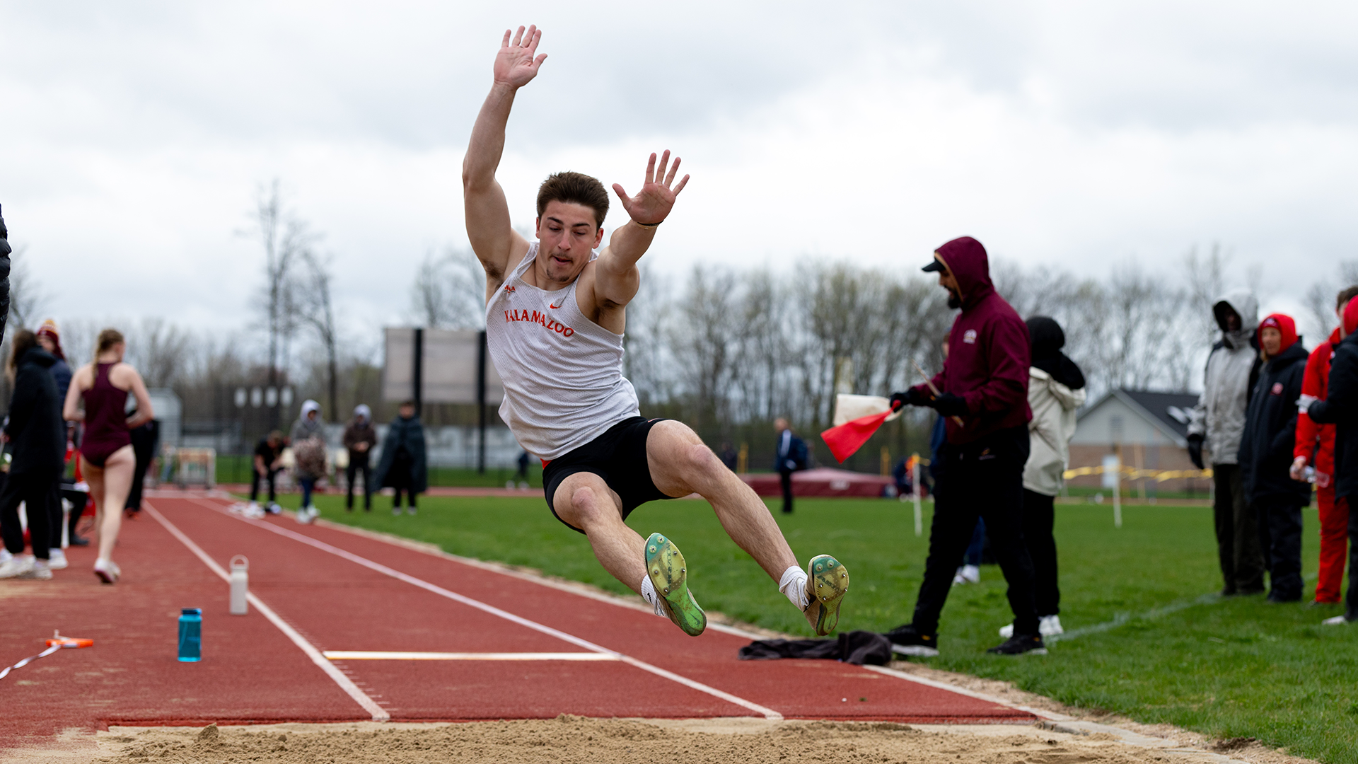 Aidan Paquin competing in long jump