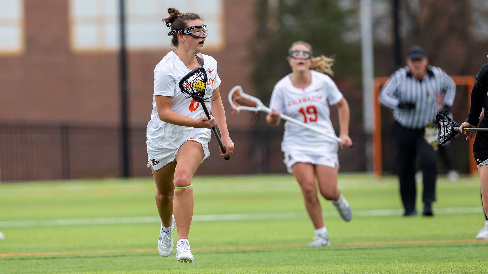 Sophie Hartl playing lacrosse